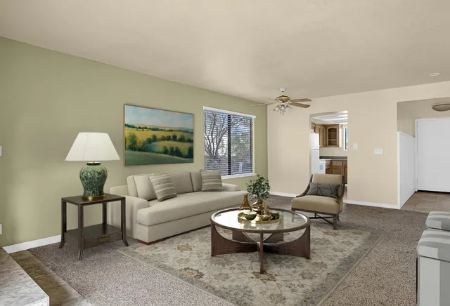 a living room with furniture and a table