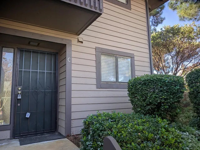 a view of a house with wooden walls