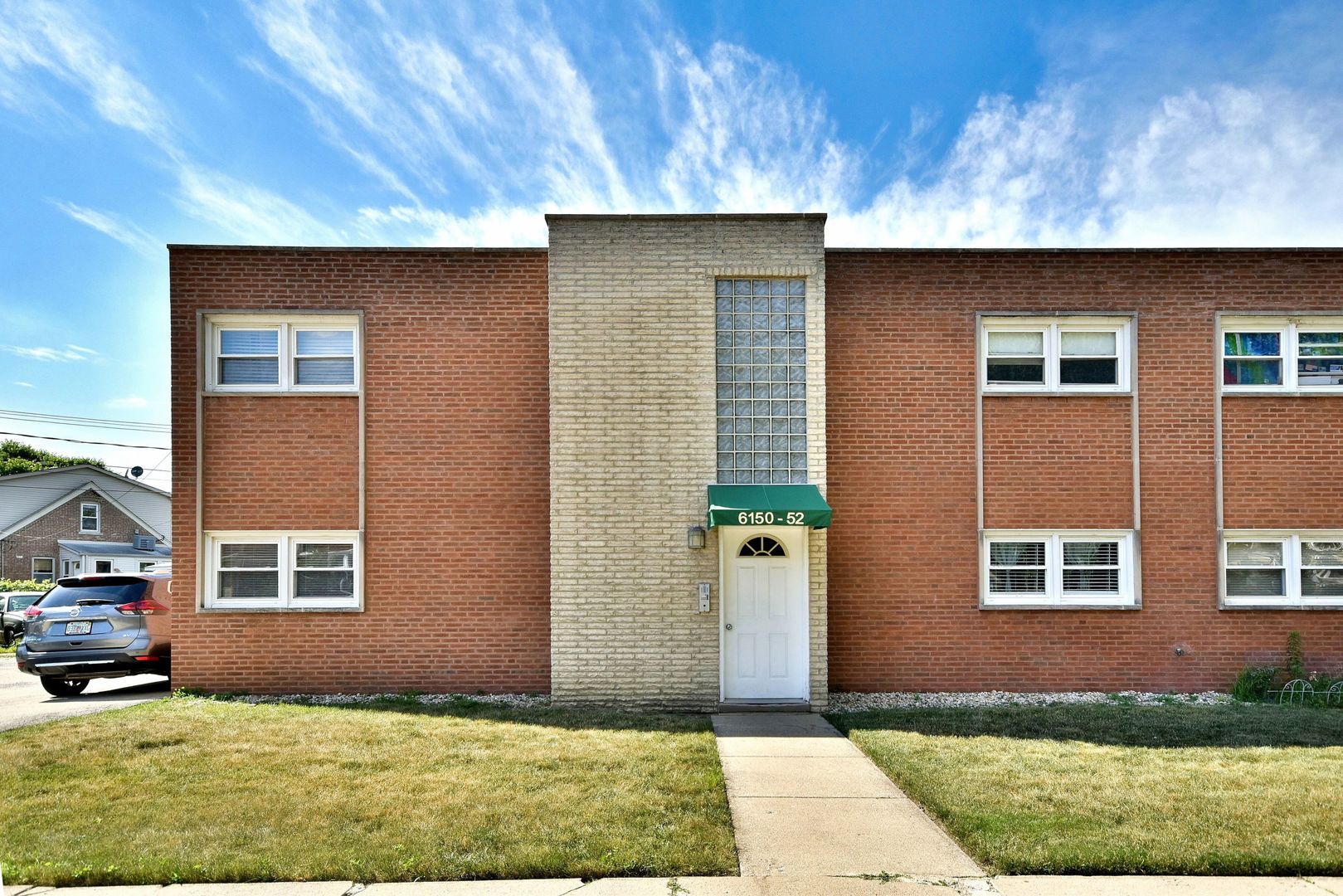 6152 West Rosedale Avenue, Unit 1 Chicago, IL 60646 - Photo 1 of 18 a front view of a house with garden