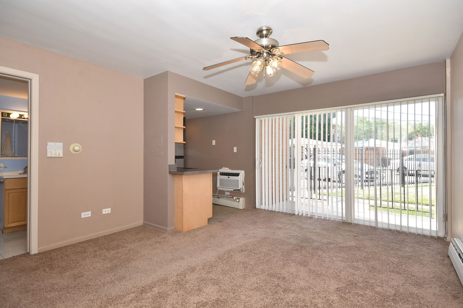 6152 West Rosedale Avenue, Unit 1 Chicago, IL 60646 - Photo 11 of 18 a view of a livingroom with a ceiling fan and window