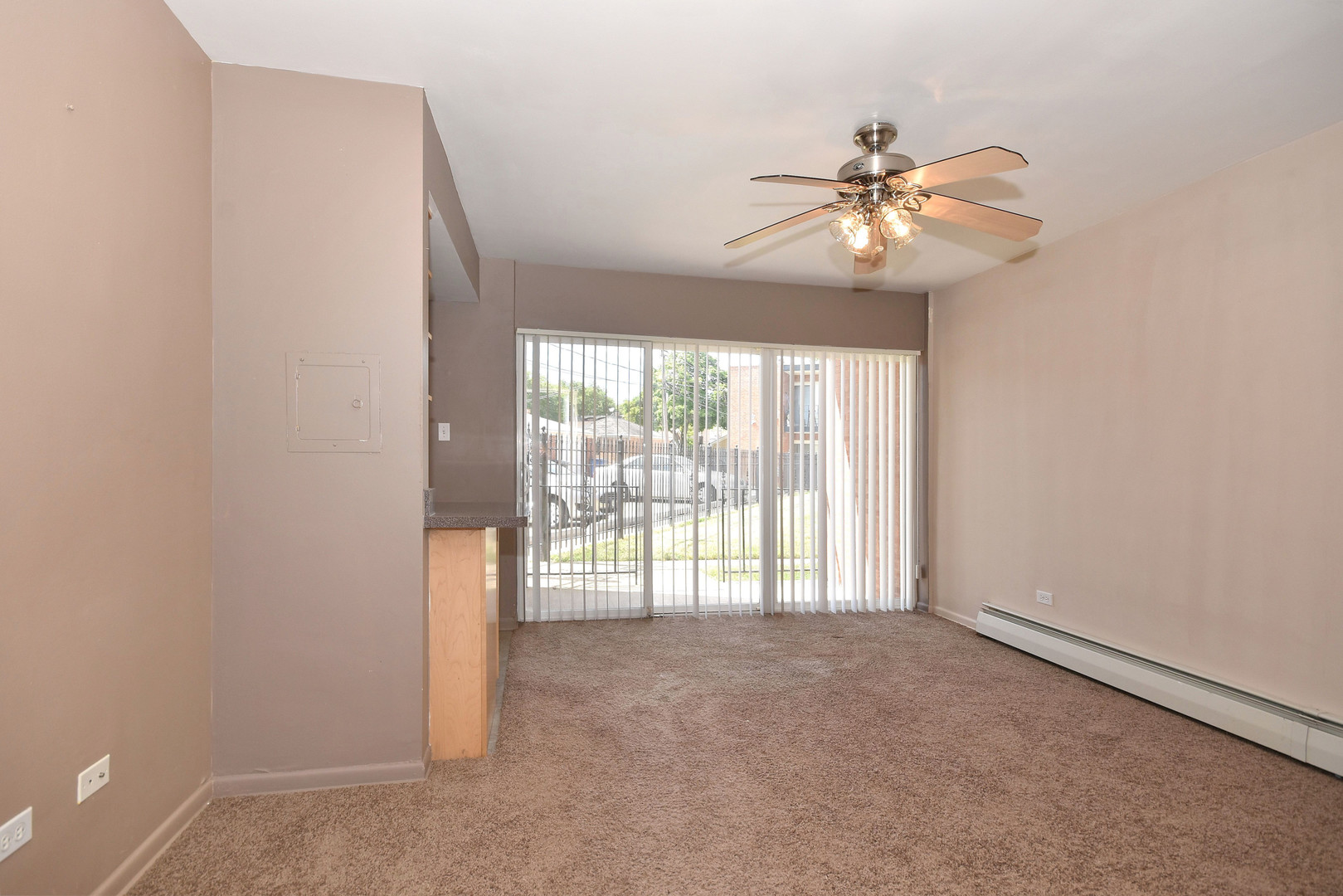 6152 West Rosedale Avenue, Unit 1 Chicago, IL 60646 - Photo 12 of 18 an empty room with windows and fan