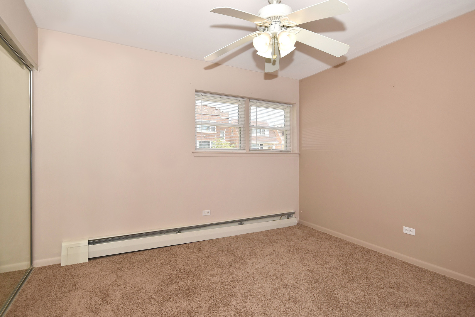 6152 West Rosedale Avenue, Unit 1 Chicago, IL 60646 - Photo 15 of 18 an empty room with a window and a fan