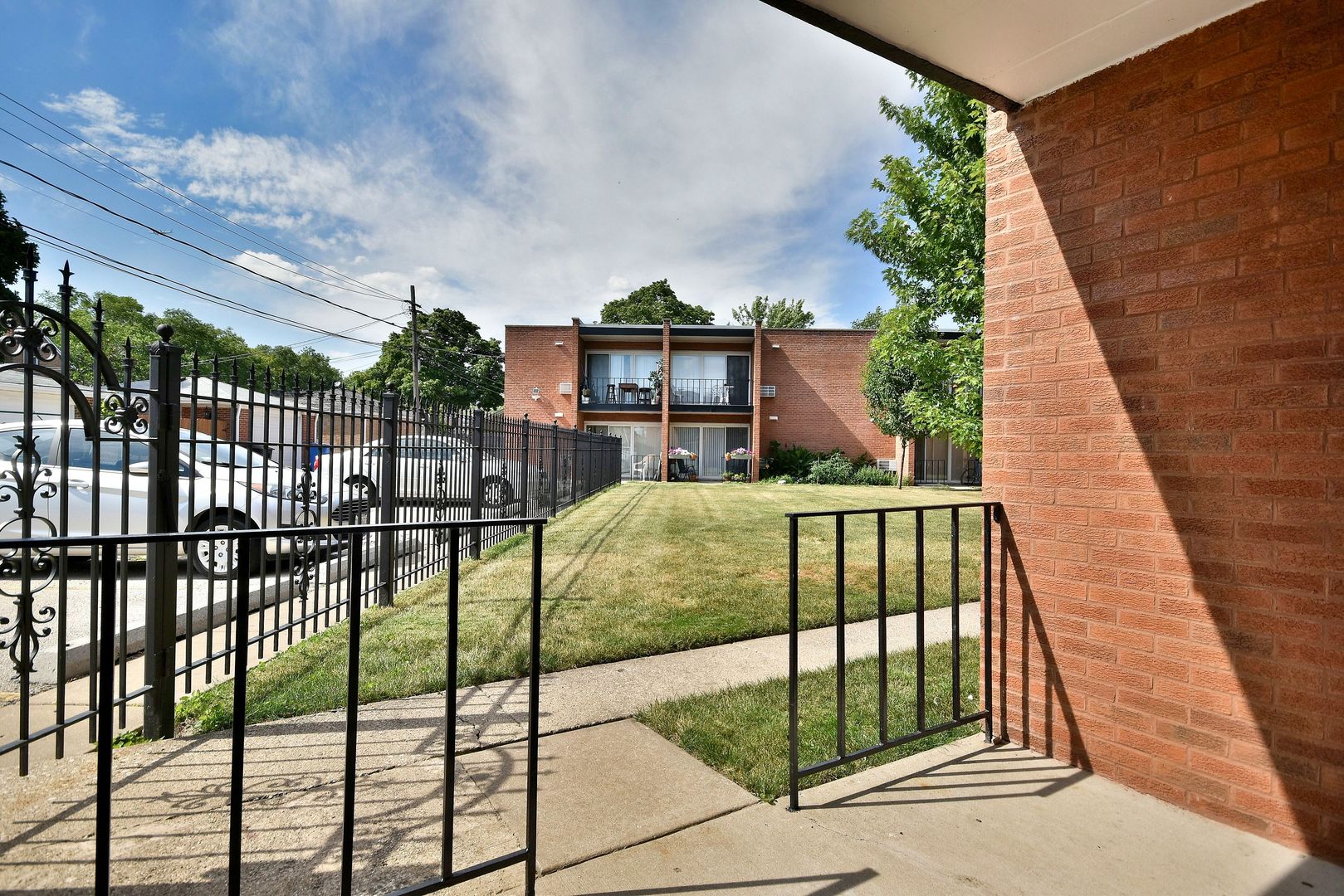6152 West Rosedale Avenue, Unit 1 Chicago, IL 60646 - Photo 8 of 18 a view of a houses with a small yard