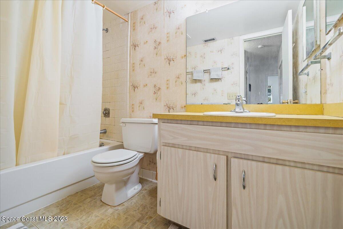 435 Dove Lane, Unit 810 Satellite Beach, FL 32937 - Photo 20 of 43 a bathroom with a sink toilet and shower