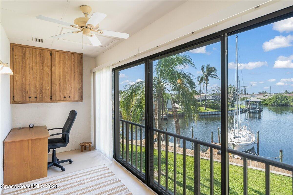 435 Dove Lane, Unit 810 Satellite Beach, FL 32937 - Photo 24 of 43 a view of a workspace with furniture and a window