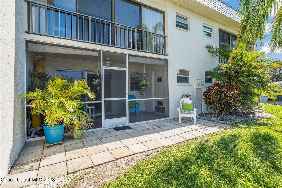 435 Dove Lane, Unit 810 Satellite Beach, FL 32937 - Photo 27 of 43 a view of front door and potted plants