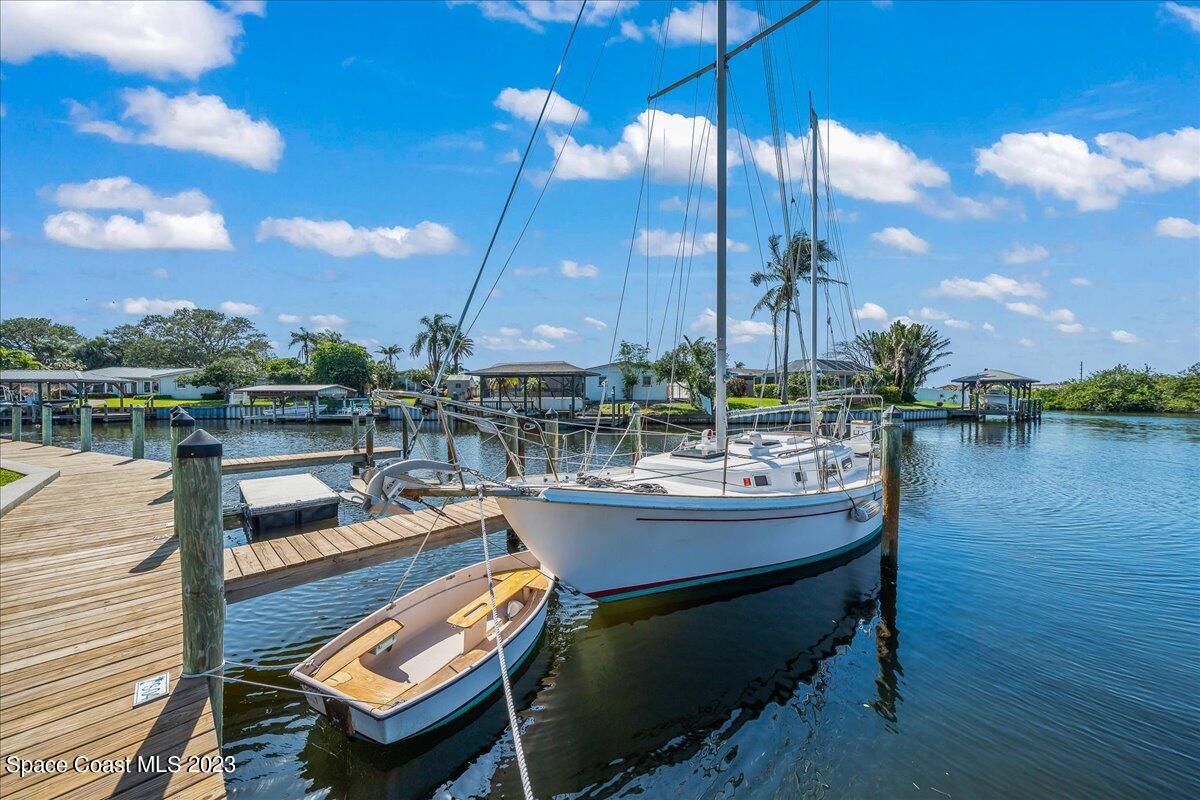 435 Dove Lane, Unit 810 Satellite Beach, FL 32937 - Photo 29 of 43 a view of a lake with chairs