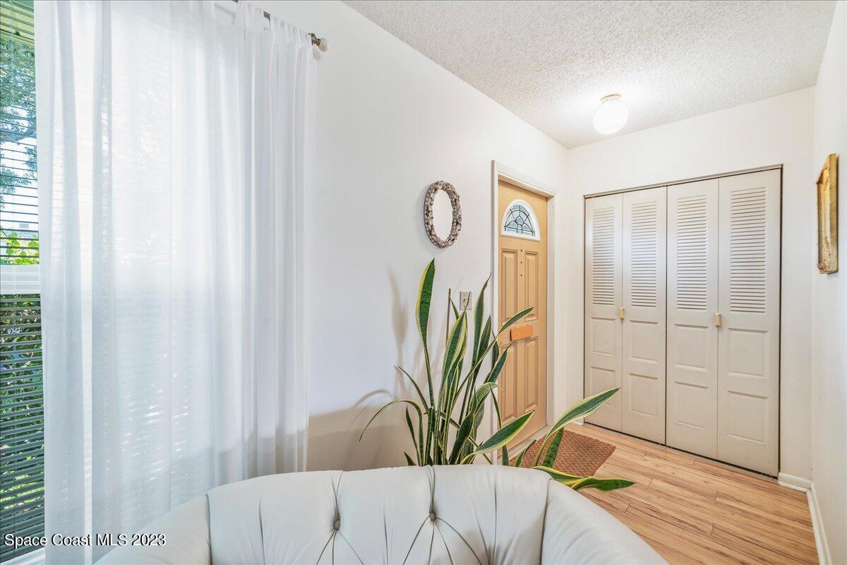 435 Dove Lane, Unit 810 Satellite Beach, FL 32937 - Photo 3 of 43 a view of a bedroom with bed and furniture
