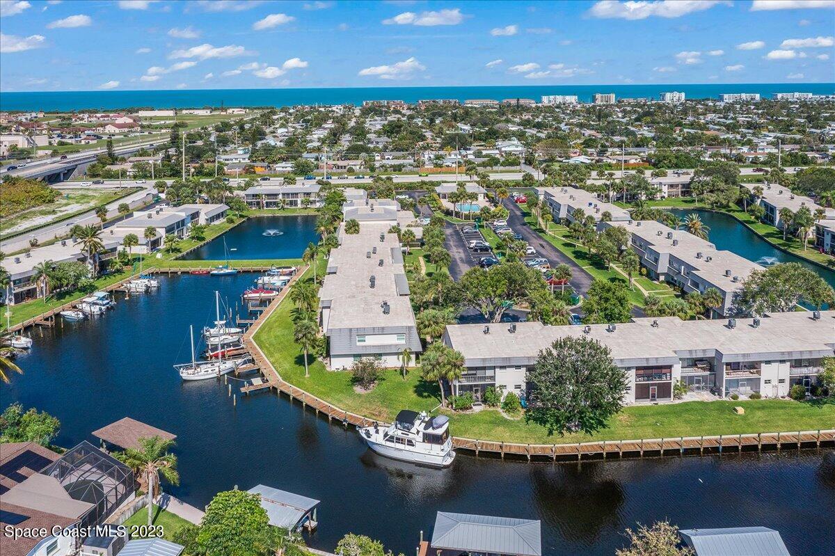 435 Dove Lane, Unit 810 Satellite Beach, FL 32937 - Photo 33 of 43 an aerial view of residential houses with outdoor space