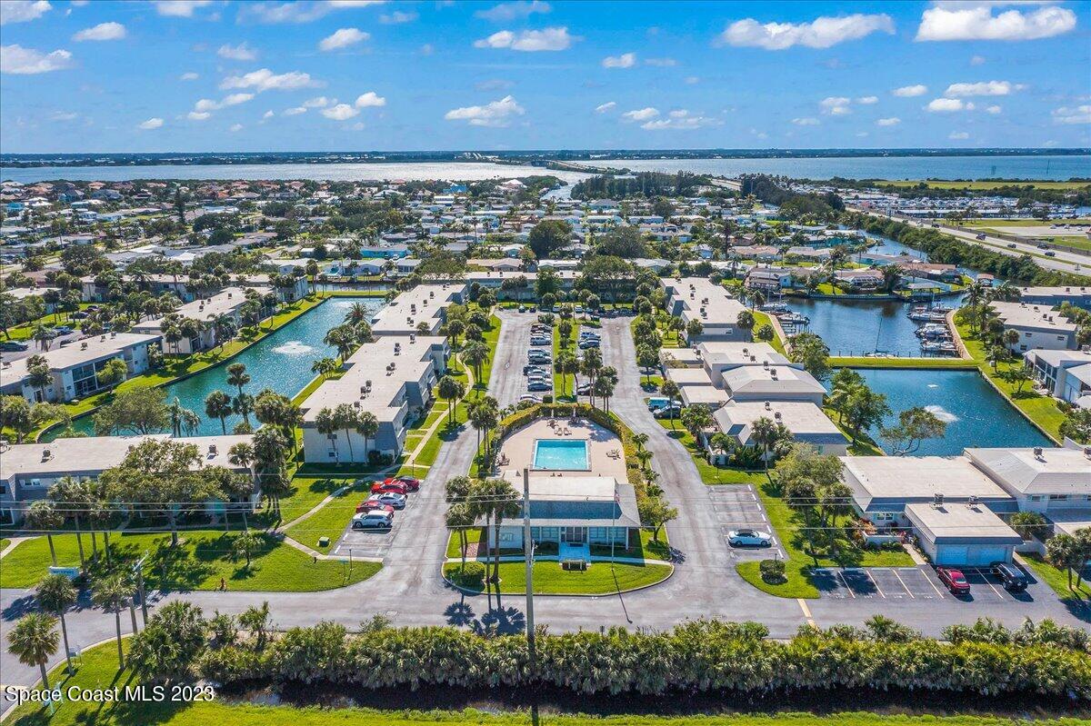 435 Dove Lane, Unit 810 Satellite Beach, FL 32937 - Photo 36 of 43 an aerial view of residential houses with outdoor space and swimming pool