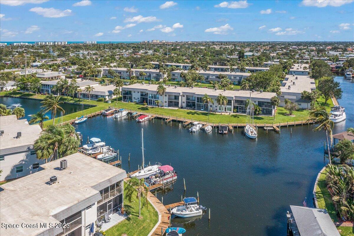 435 Dove Lane, Unit 810 Satellite Beach, FL 32937 - Photo 38 of 43 an aerial view of a house with a lake view