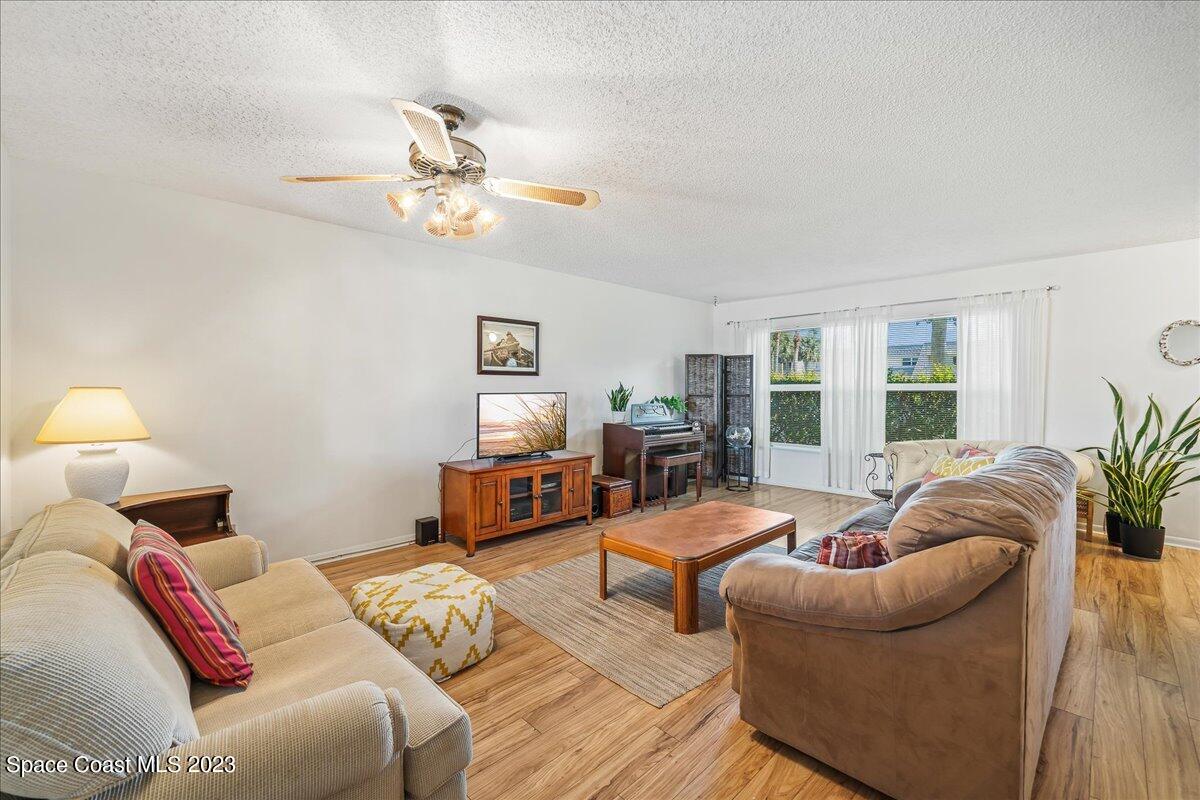 435 Dove Lane, Unit 810 Satellite Beach, FL 32937 - Photo 4 of 43 a bedroom with furniture and a large window