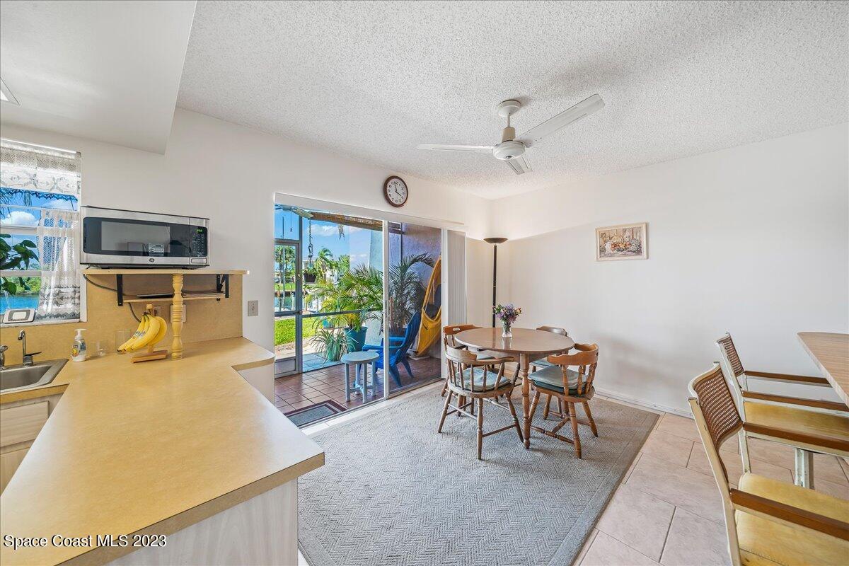 435 Dove Lane, Unit 810 Satellite Beach, FL 32937 - Photo 9 of 43 a view of a dining room with furniture window and outside view