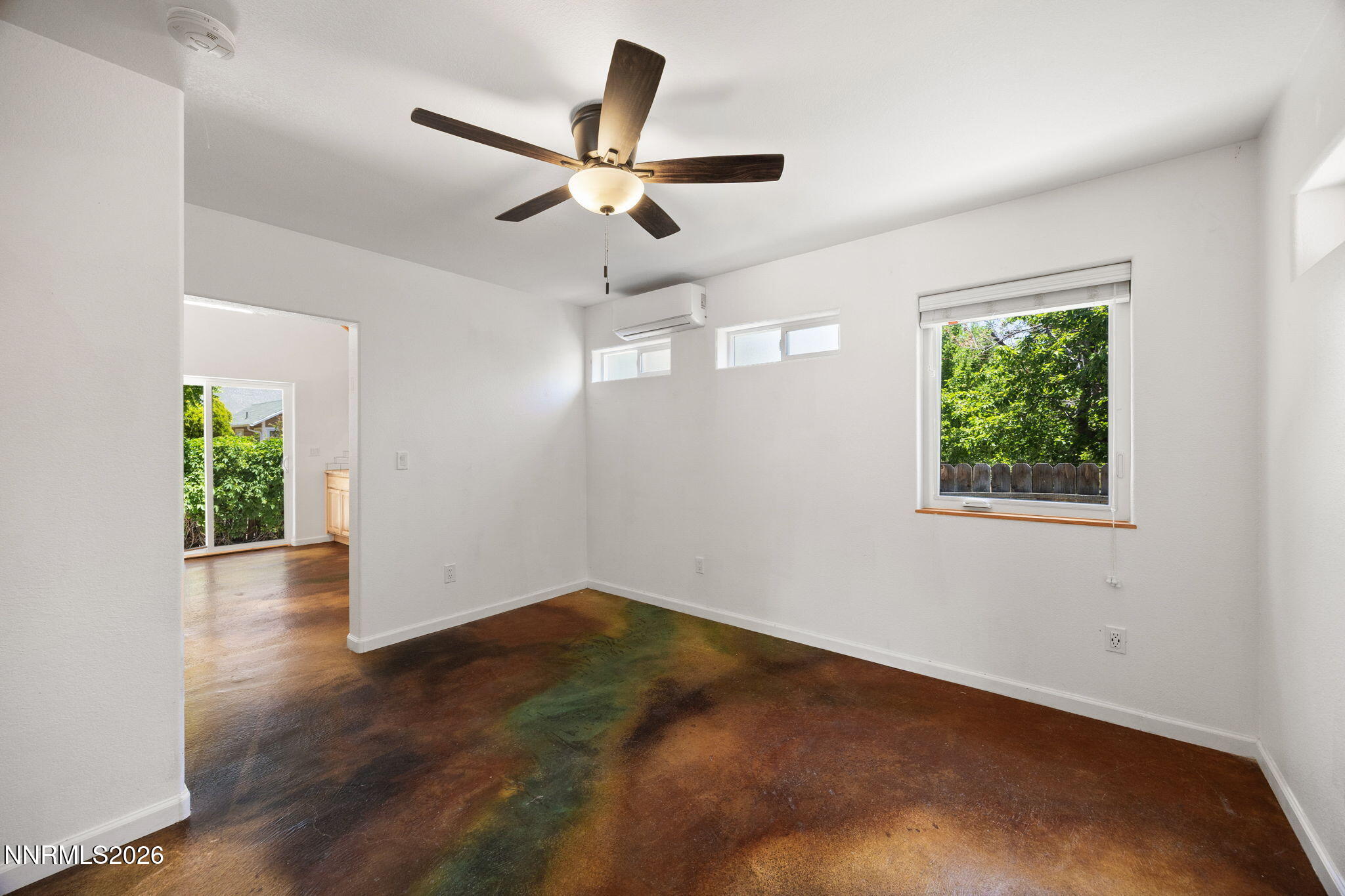 1350 Ridgeway Court Reno, NV 89503 - Photo 16 of 34 a view of an empty room with wooden floor and a window