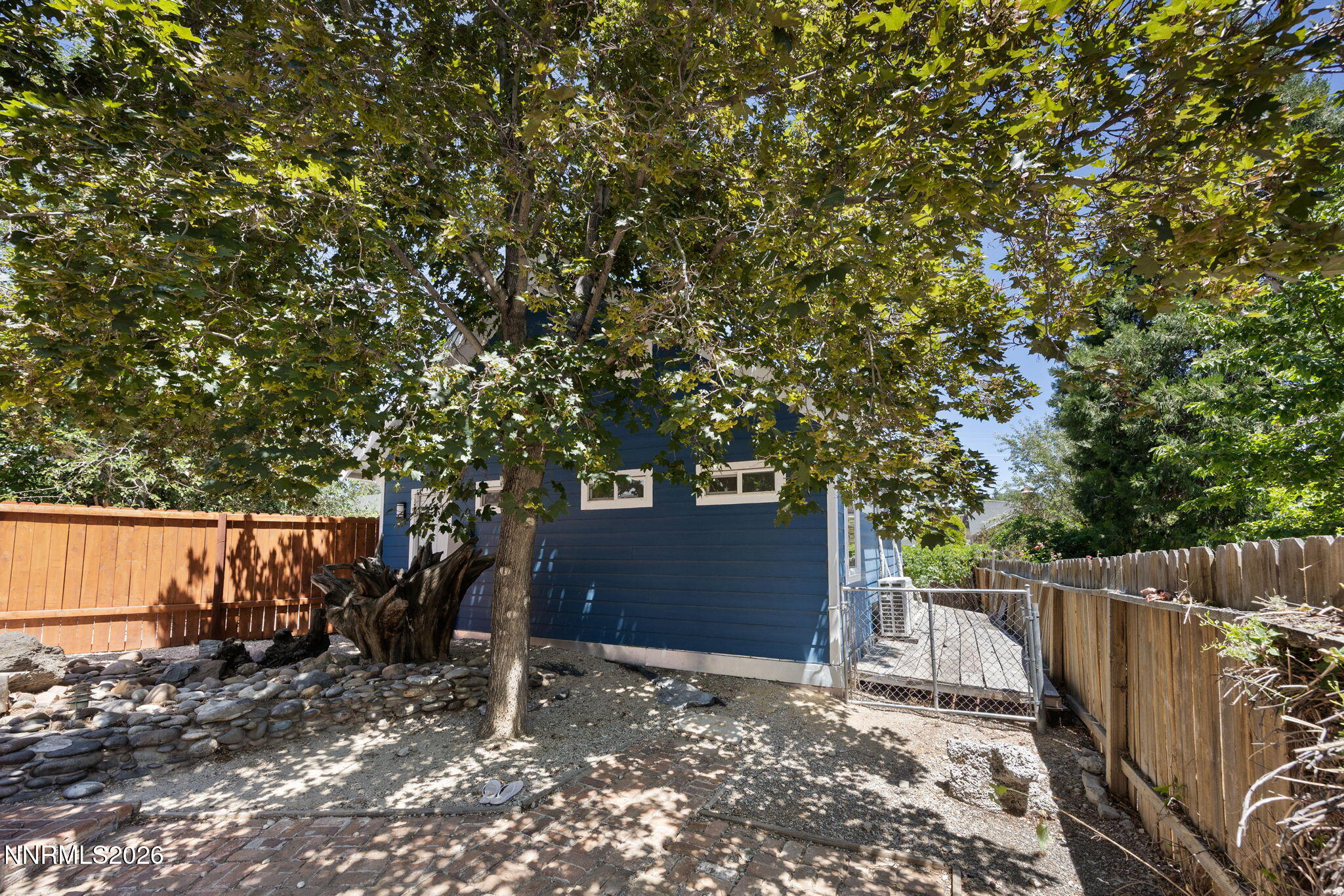 1350 Ridgeway Court Reno, NV 89503 - Photo 33 of 34 a backyard of a house with lots of tree