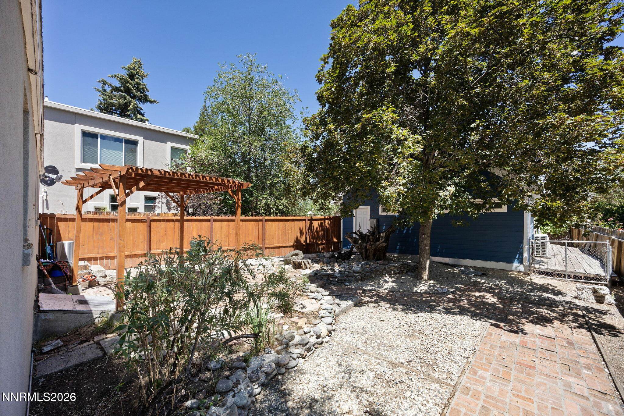 1350 Ridgeway Court Reno, NV 89503 - Photo 34 of 34 a view of a backyard with a tree