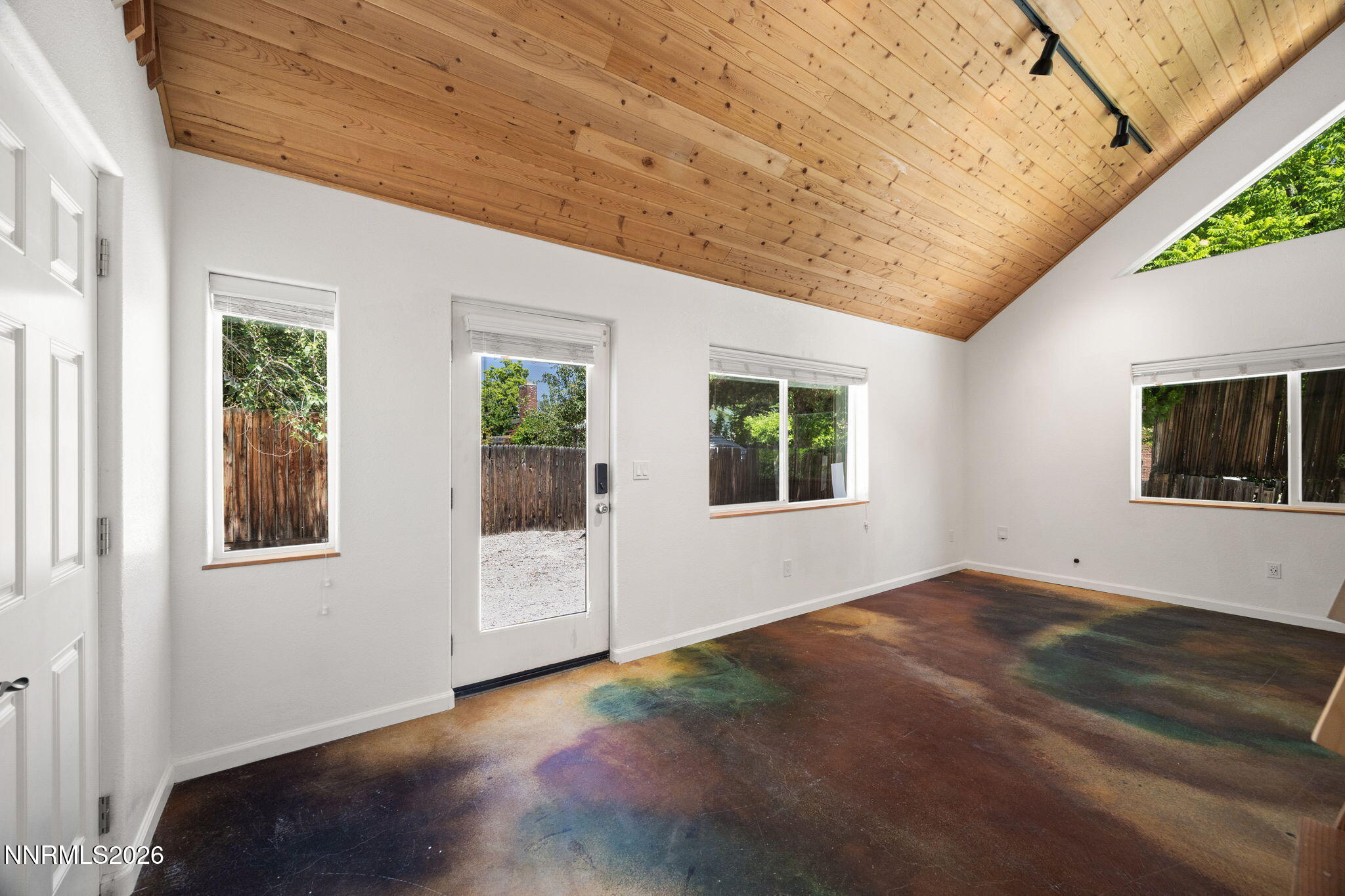 1350 Ridgeway Court Reno, NV 89503 - Photo 8 of 34 a view of an empty room with a window and wooden floor