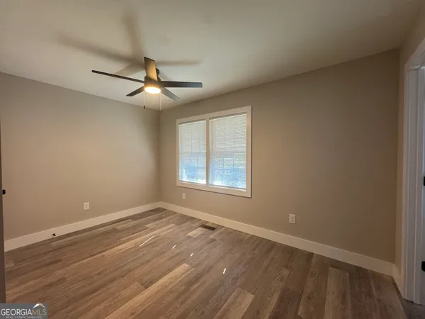 a bathroom with a toilet sink a shower and