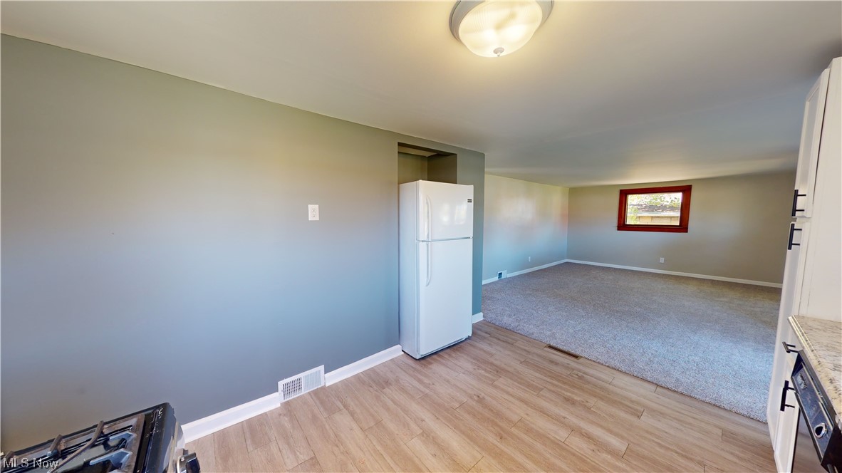 852 East Waterloo Road Akron, OH 44306 - Photo 11 of 24 Empty room featuring light colored carpet