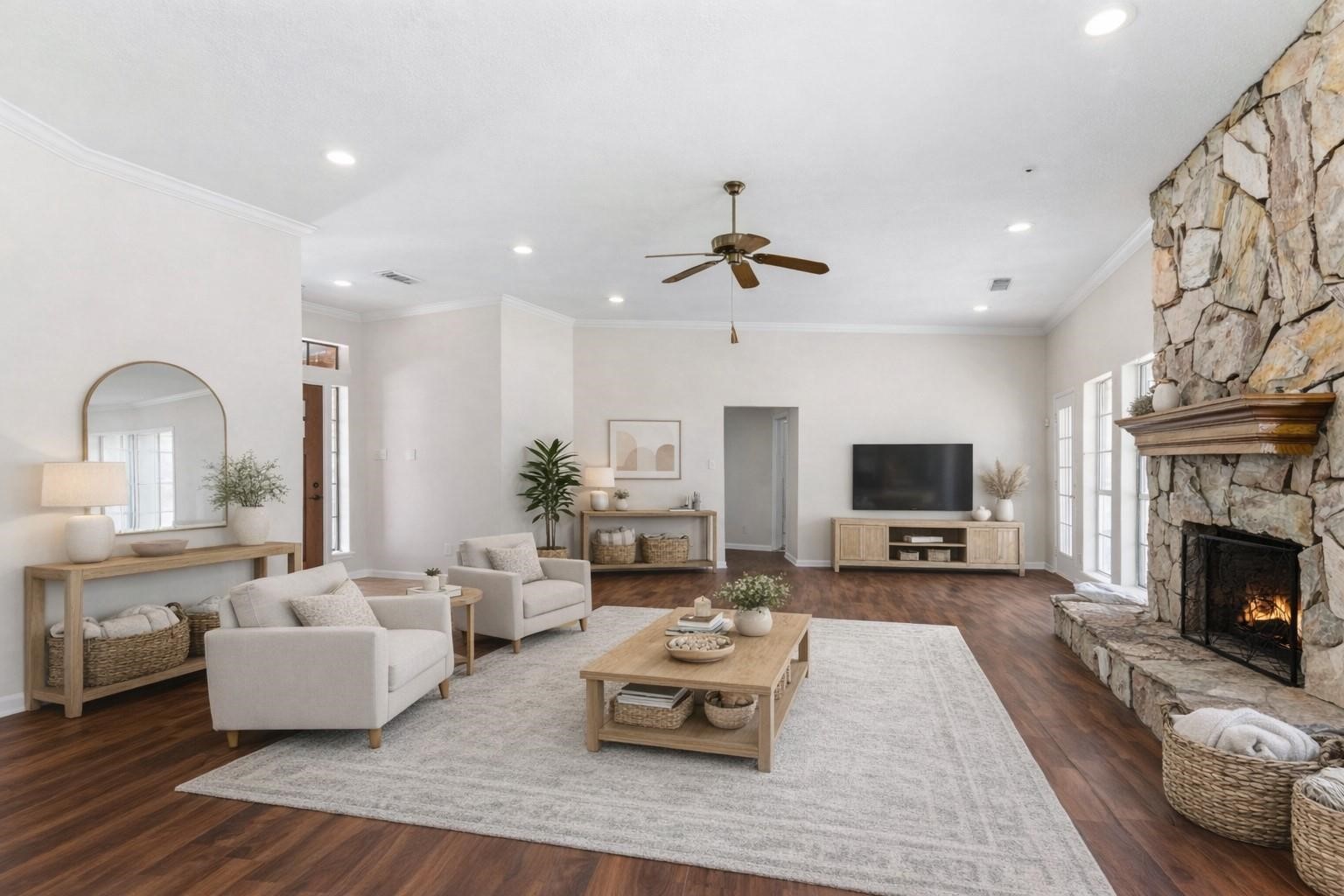 7825 Hughes Ranch Road Pearland, TX 77581 - Photo 7 of 28 (Virtually Staged)
The stone fireplace anchors the room with undeniable presence while expansive windows frame the beautiful outdoor surroundings. A warm, welcoming focal point from every angle.