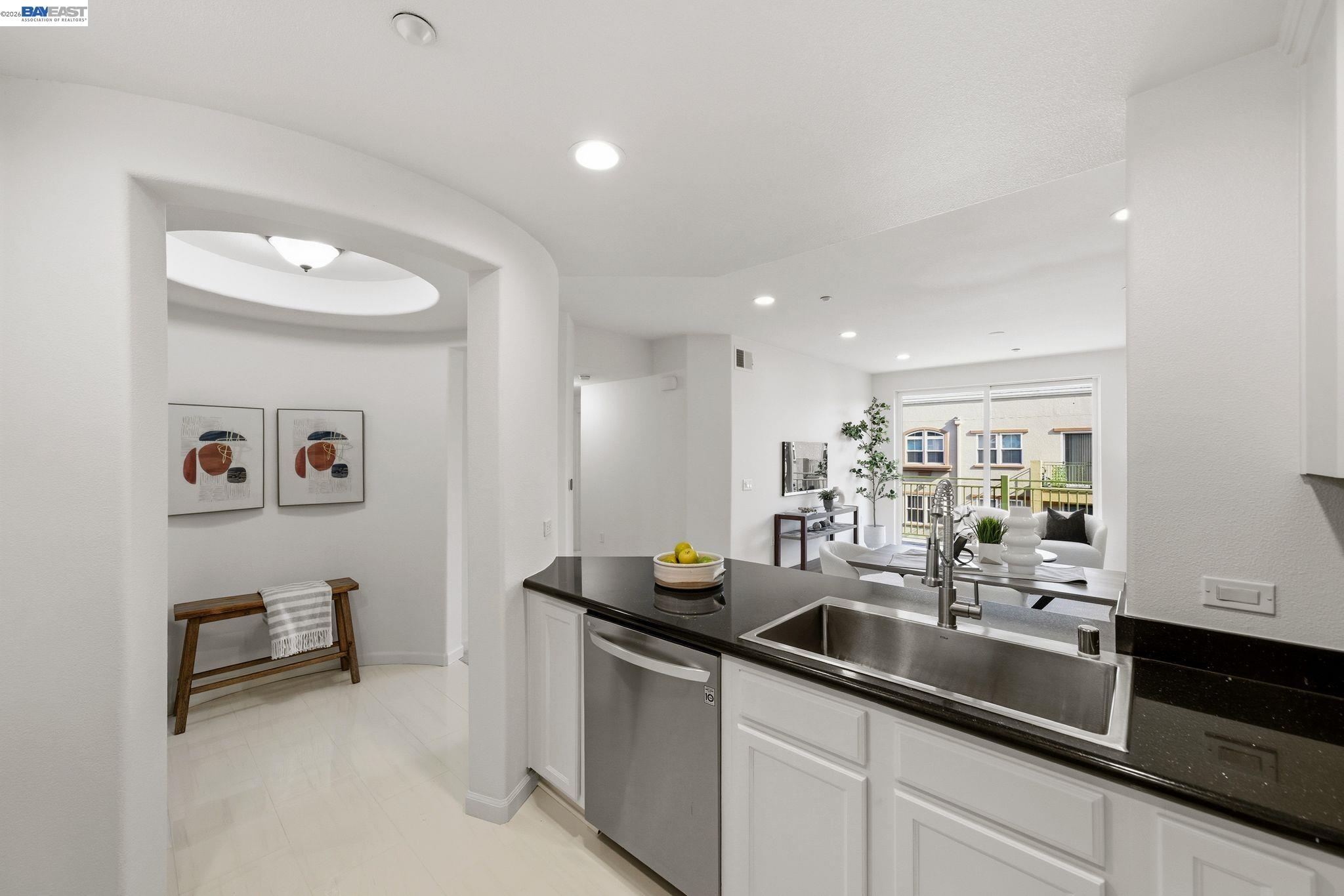 49002 Cinnamon Fern Common, Unit 507 Fremont, CA 94539 - Photo 11 of 41 a kitchen with a sink and a refrigerator
