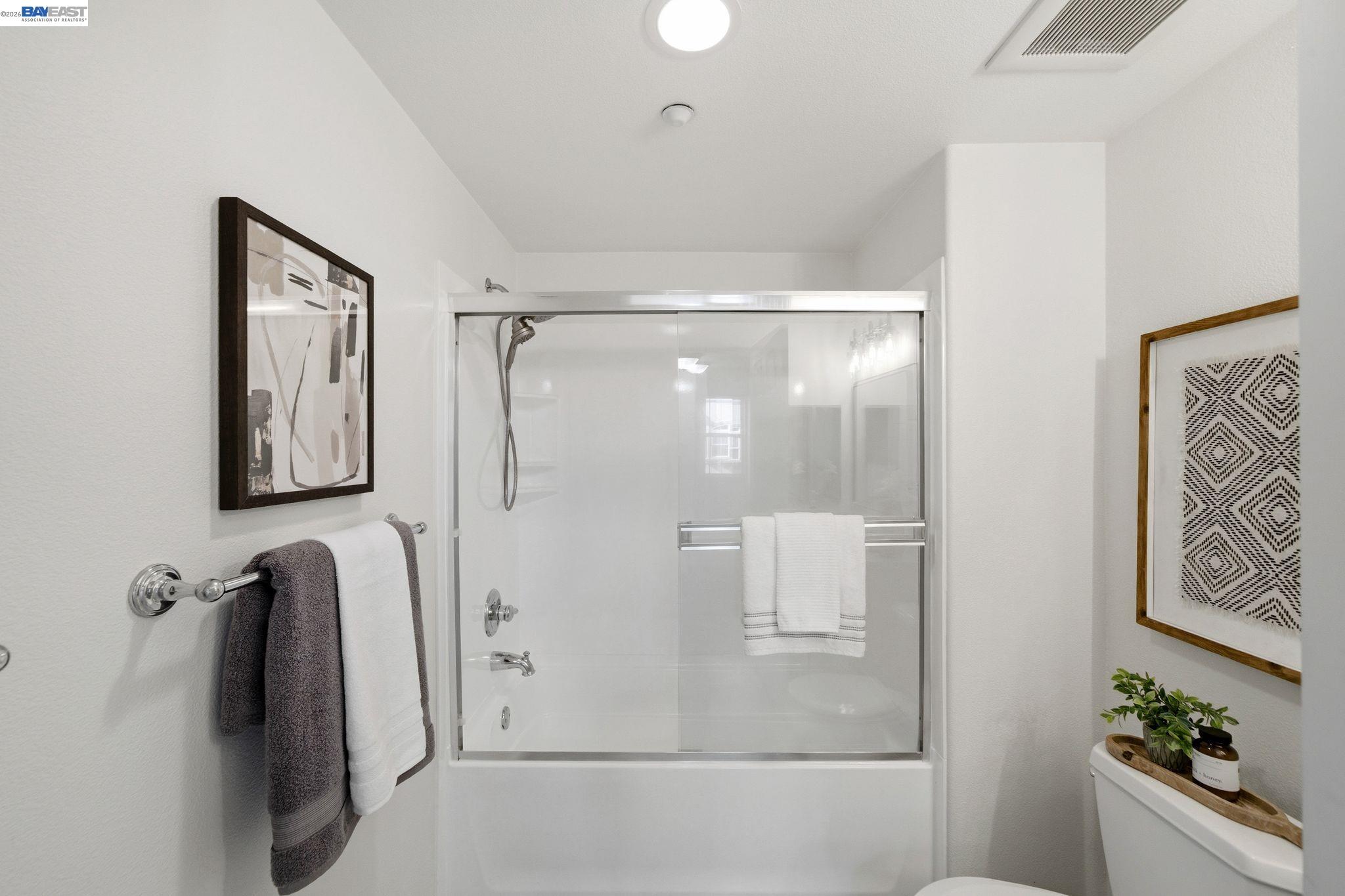 49002 Cinnamon Fern Common, Unit 507 Fremont, CA 94539 - Photo 19 of 41 a bathroom with a shower and a mirror