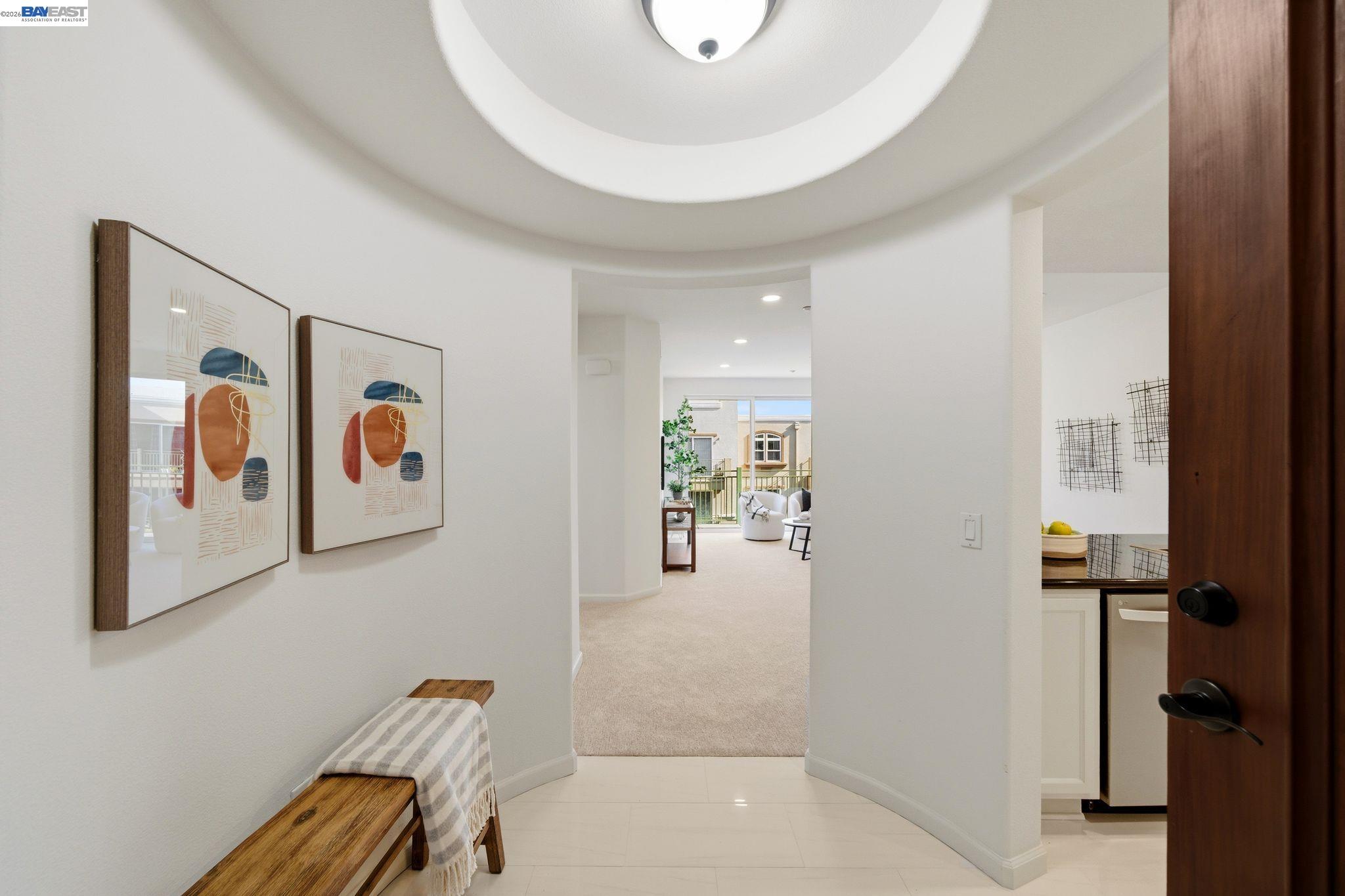 49002 Cinnamon Fern Common, Unit 507 Fremont, CA 94539 - Photo 2 of 41 a view of a hallway with workspace