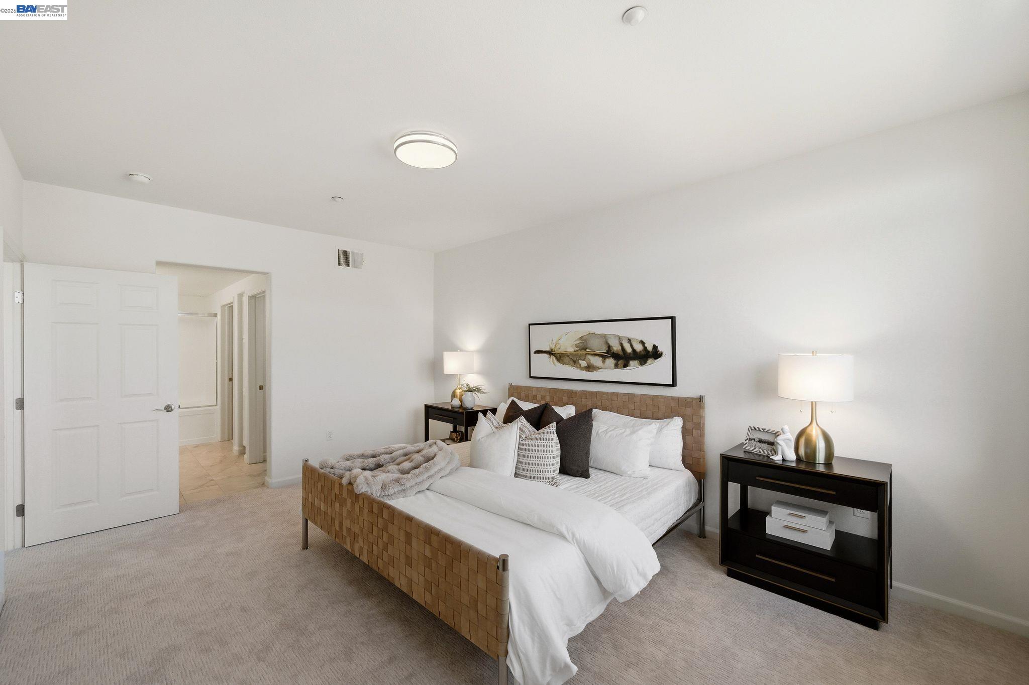 49002 Cinnamon Fern Common, Unit 507 Fremont, CA 94539 - Photo 23 of 41 a bedroom with a bed and a night stand