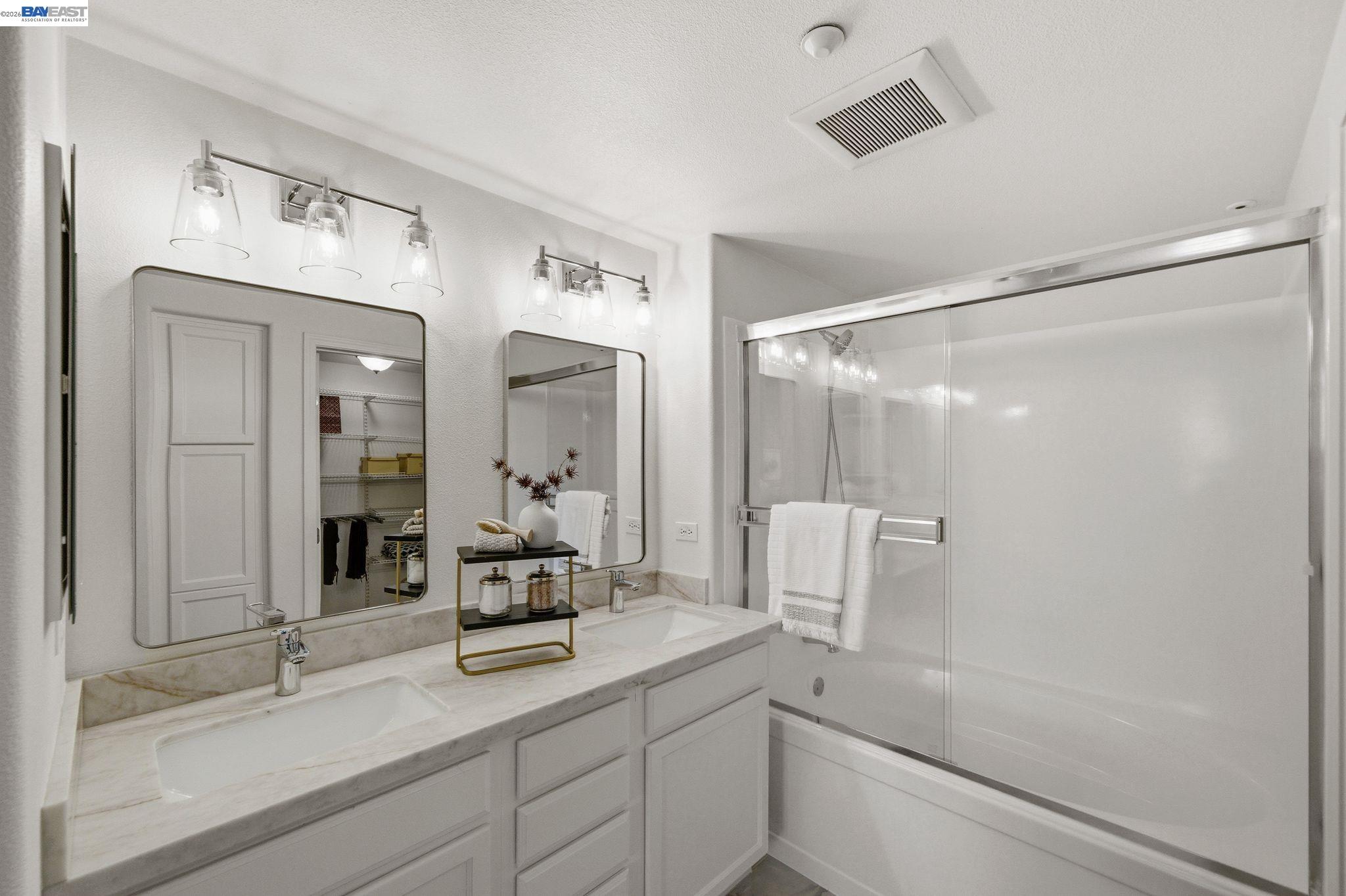 49002 Cinnamon Fern Common, Unit 507 Fremont, CA 94539 - Photo 26 of 41 a bathroom with a sink and a mirror