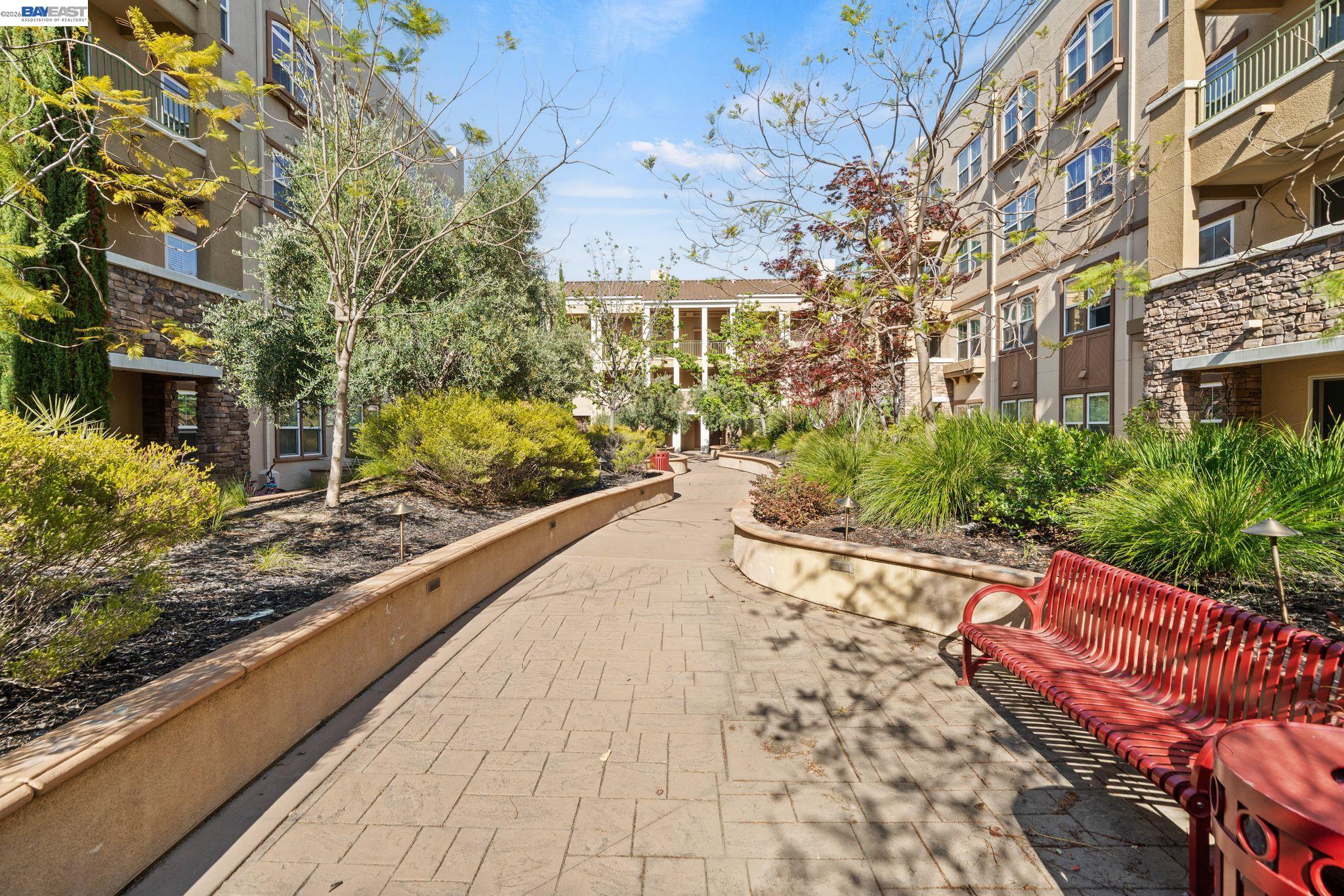 49002 Cinnamon Fern Common, Unit 507 Fremont, CA 94539 - Photo 29 of 41 a view of a pathway with a yard