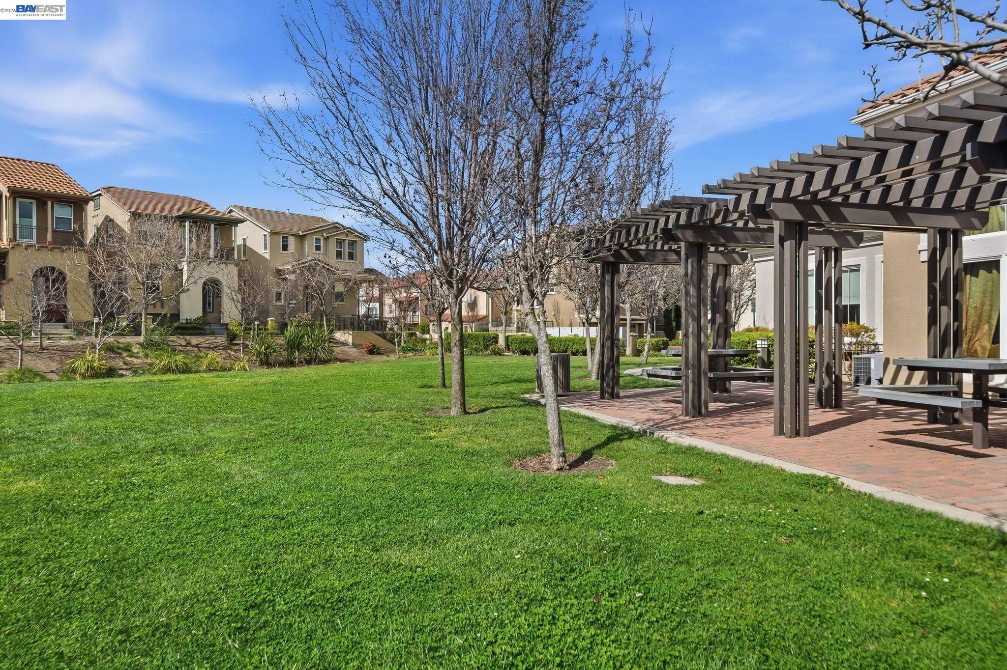 49002 Cinnamon Fern Common, Unit 507 Fremont, CA 94539 - Photo 34 of 41 a view of a park with swings and slides