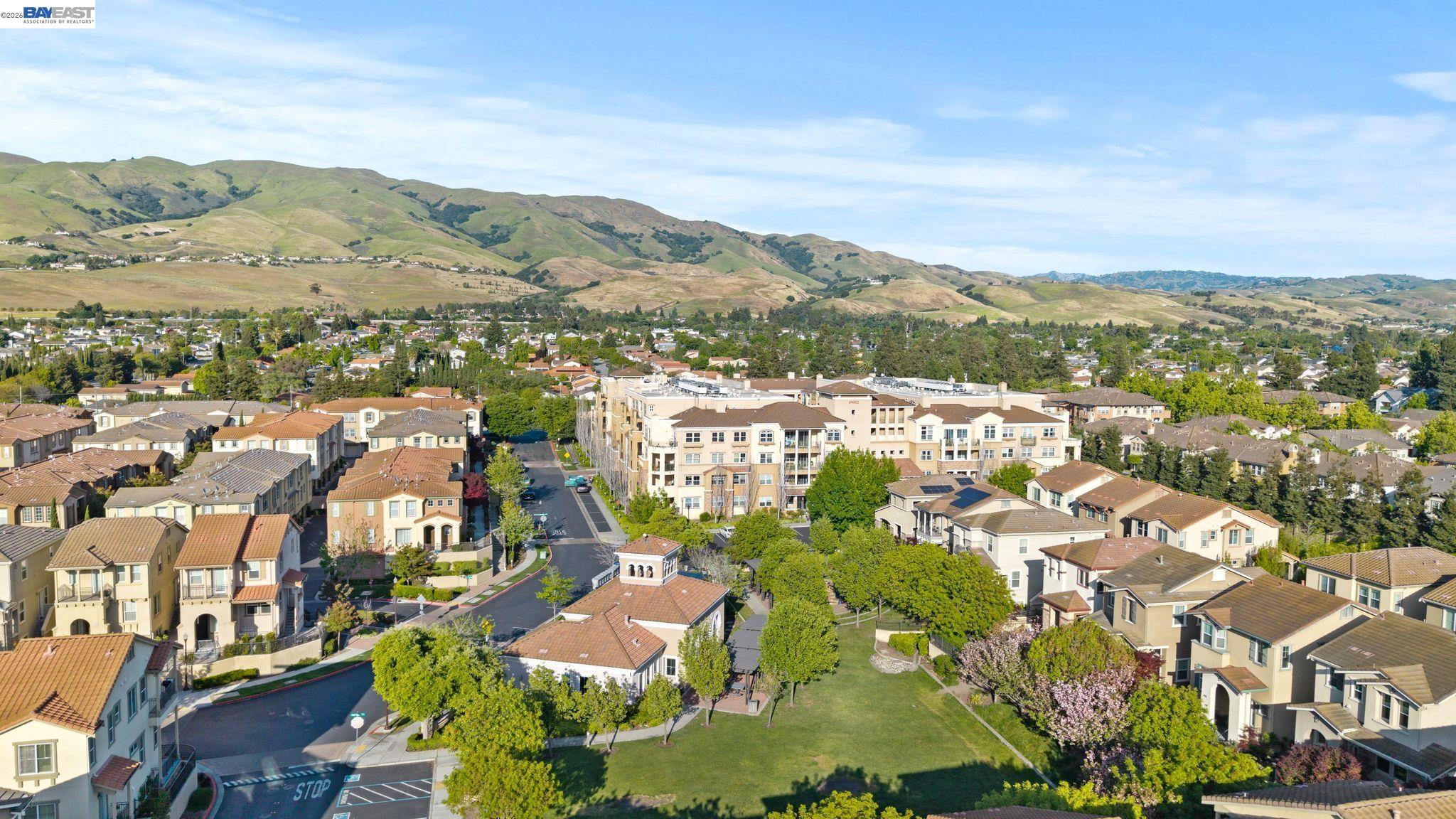 49002 Cinnamon Fern Common, Unit 507 Fremont, CA 94539 - Photo 38 of 41 an aerial view of residential houses with outdoor space