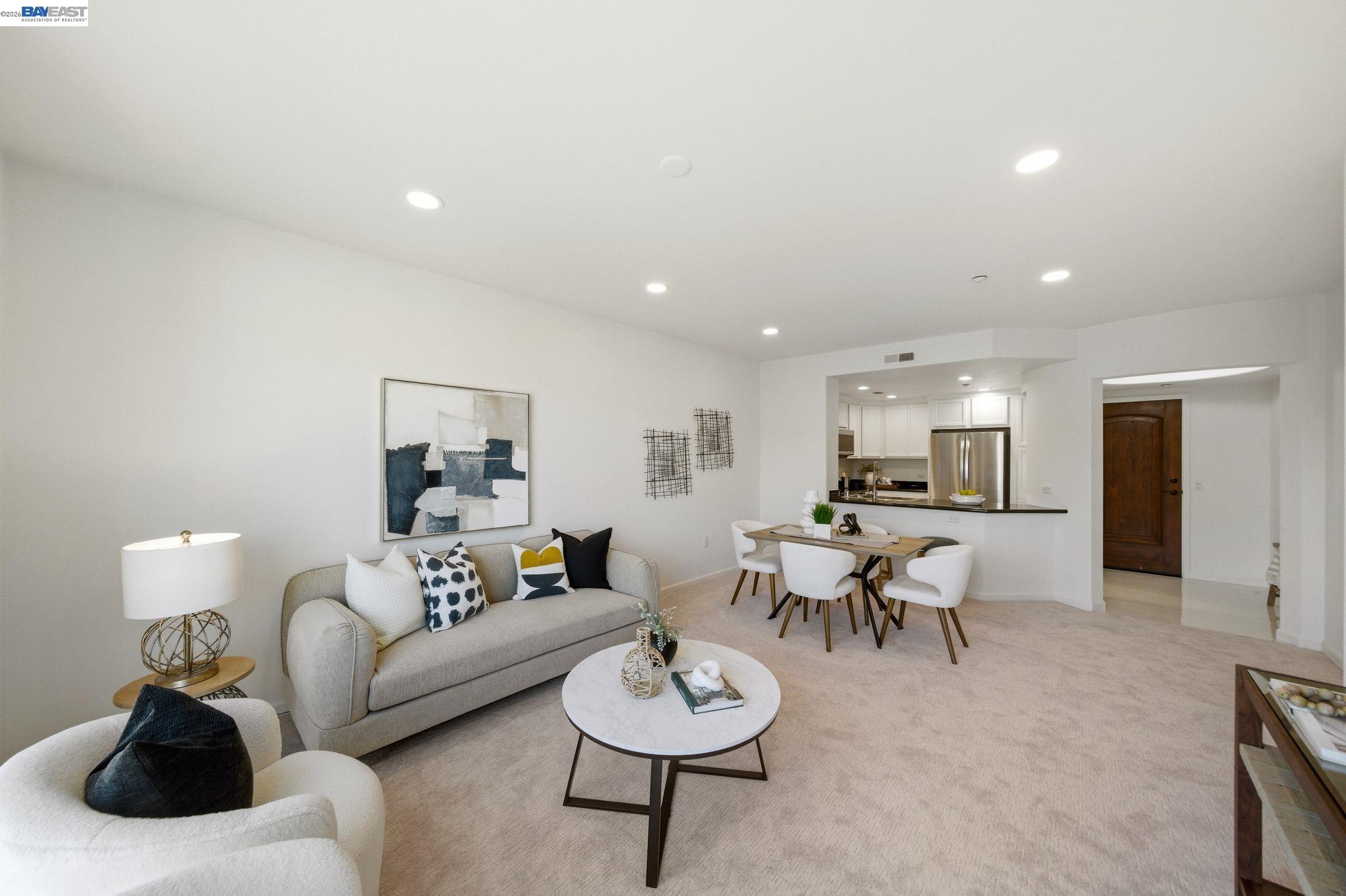49002 Cinnamon Fern Common, Unit 507 Fremont, CA 94539 - Photo 4 of 41 a living room with furniture and a wooden floor