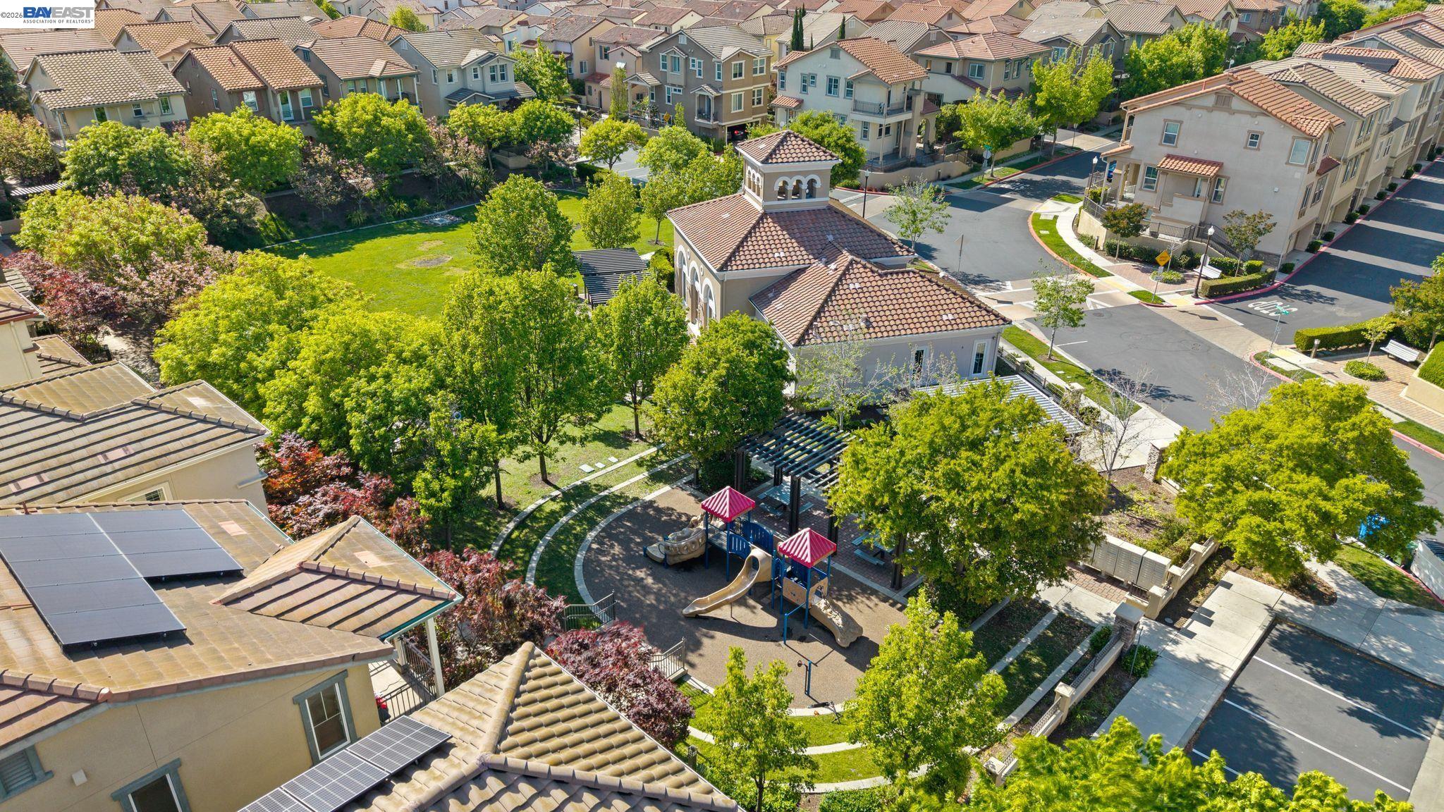 49002 Cinnamon Fern Common, Unit 507 Fremont, CA 94539 - Photo 41 of 41 an aerial view of multiple houses with yard