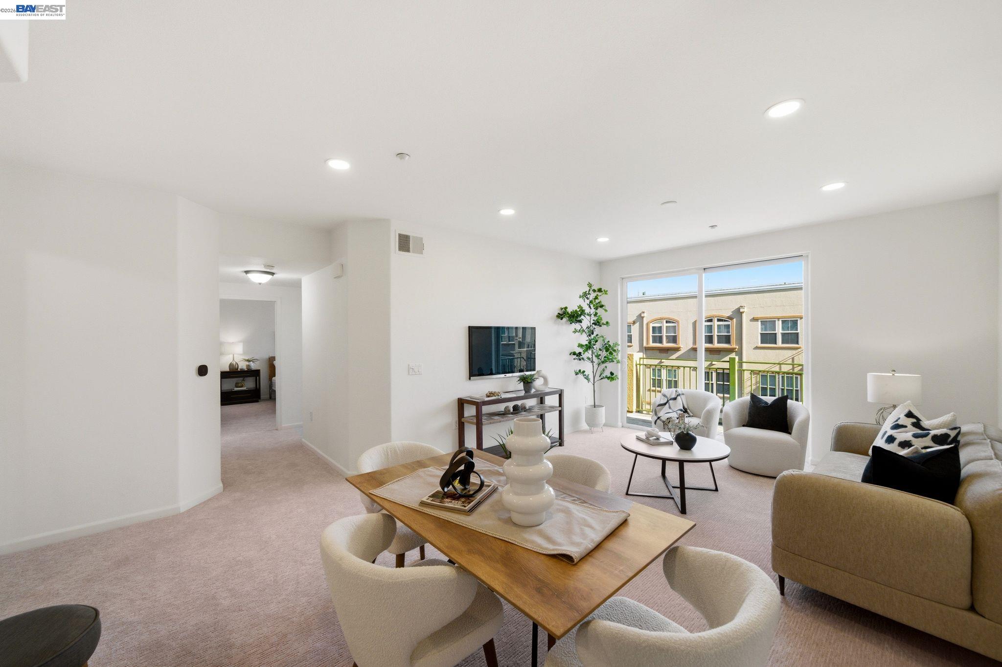 49002 Cinnamon Fern Common, Unit 507 Fremont, CA 94539 - Photo 6 of 41 a living room with furniture and a large window