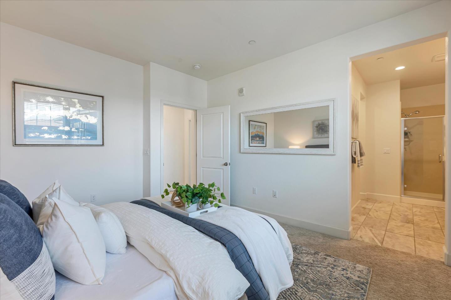 103 Incense Terrace Sunnyvale, CA 94086 - Photo 23 of 42 a bedroom with a bed and a painting on the wall