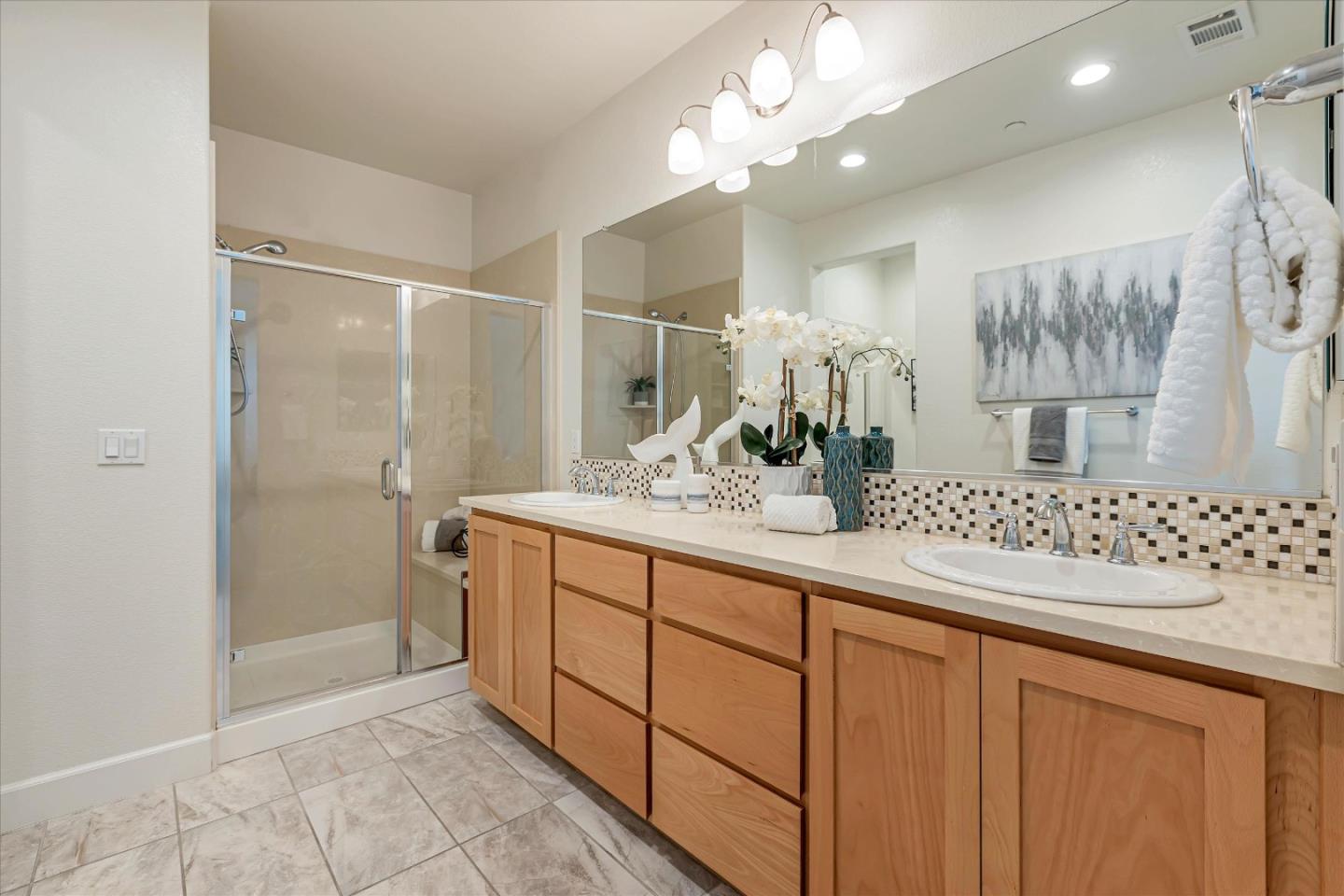 103 Incense Terrace Sunnyvale, CA 94086 - Photo 27 of 42 a bathroom with a double vanity sink mirror and shower