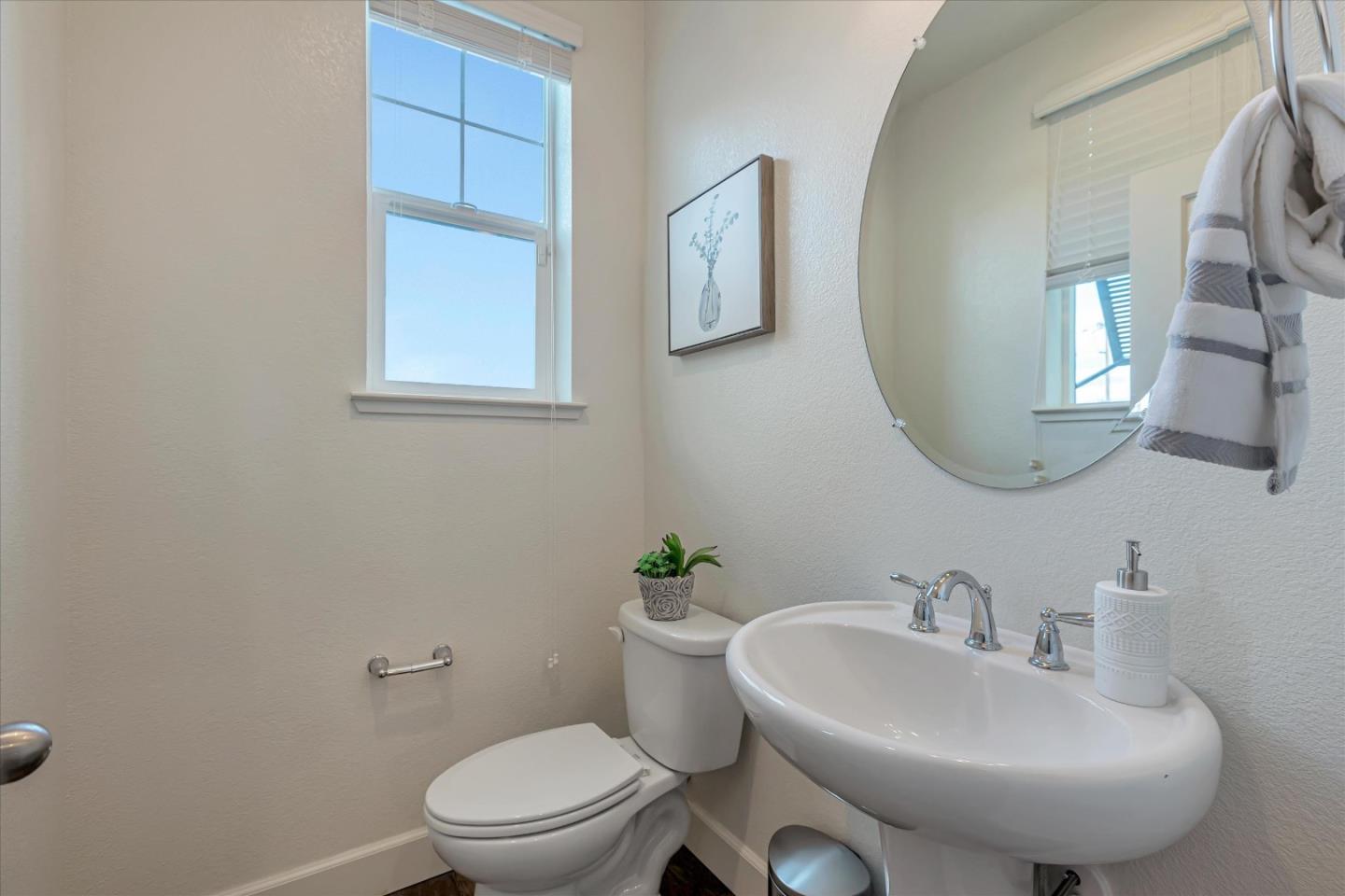 103 Incense Terrace Sunnyvale, CA 94086 - Photo 31 of 42 a bathroom with a sink a mirror and a toilet