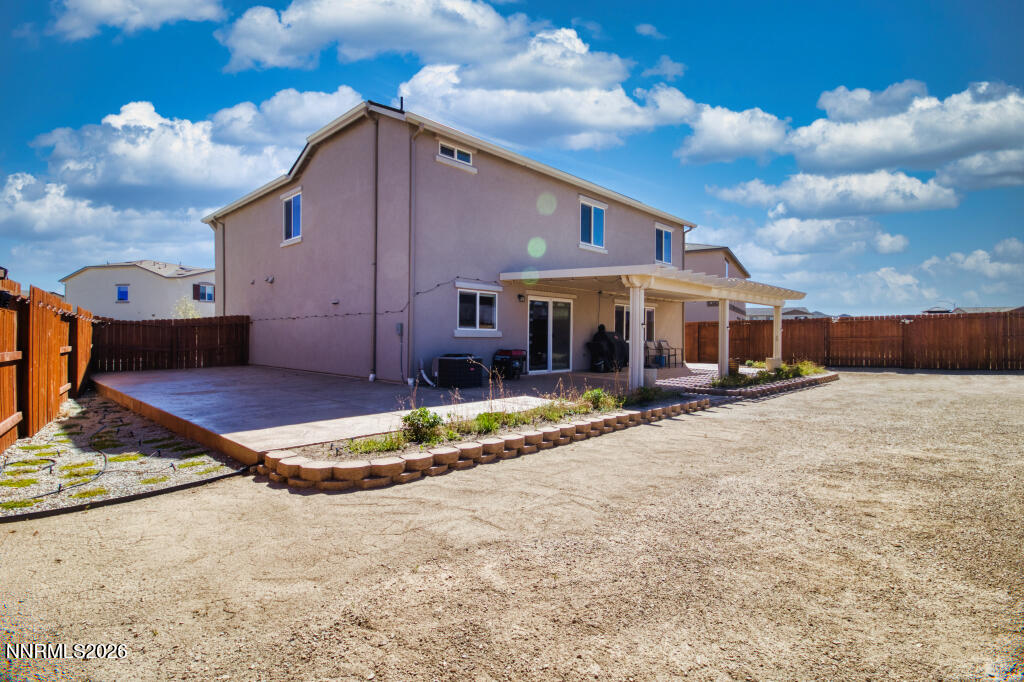 8957 Buffalo Grove Drive Reno, NV 89506 - Photo 42 of 59 a front view of a house with a yard