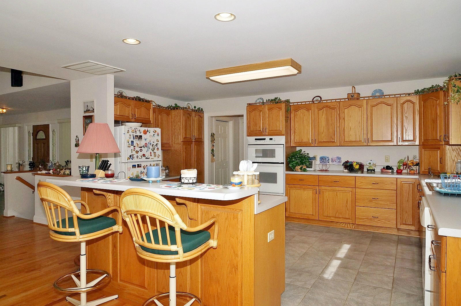 925 Somerset Cove Road Union Hall, VA 24176 - Photo 11 of 35 a view of a kitchen with kitchen island granite countertop a table and chairs in it