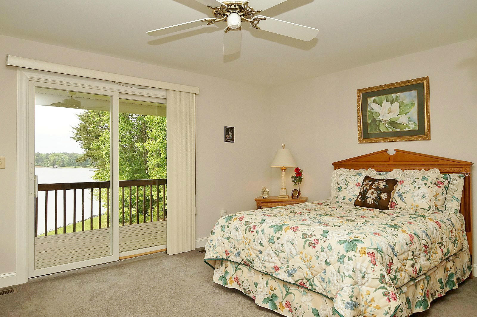 925 Somerset Cove Road Union Hall, VA 24176 - Photo 14 of 35 a bedroom with a balcony a bed and a window