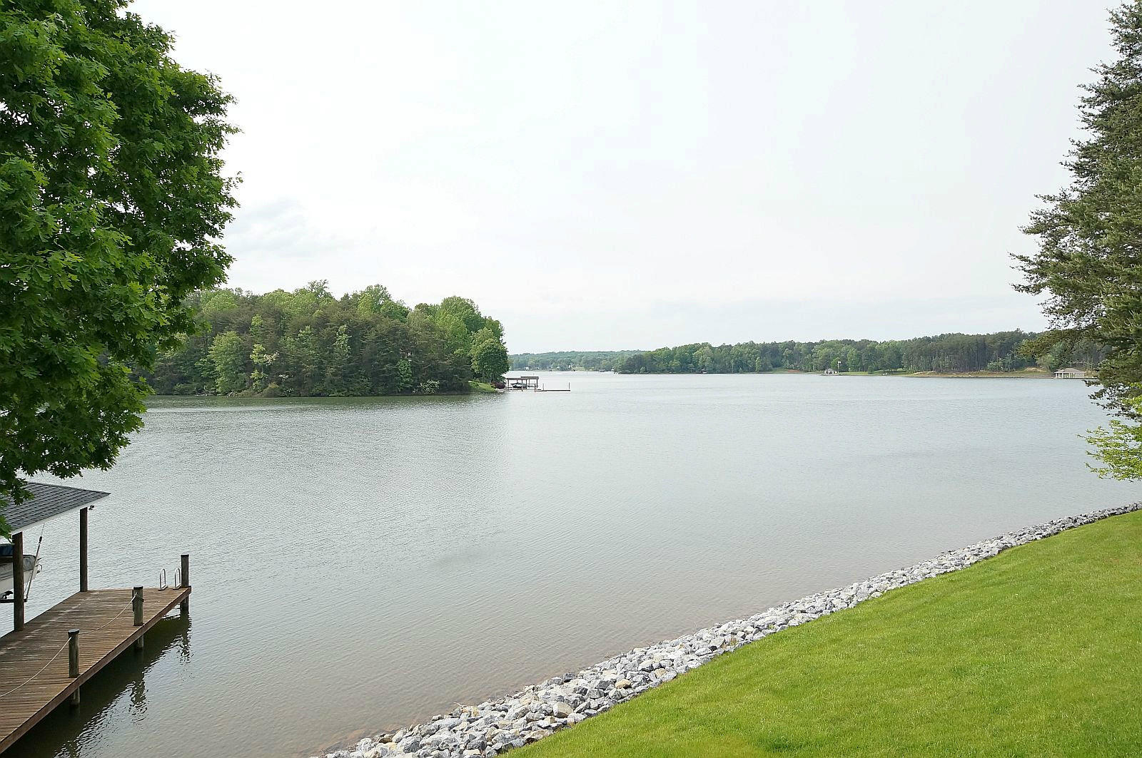 925 Somerset Cove Road Union Hall, VA 24176 - Photo 19 of 35 a view of a lake with houses in the back