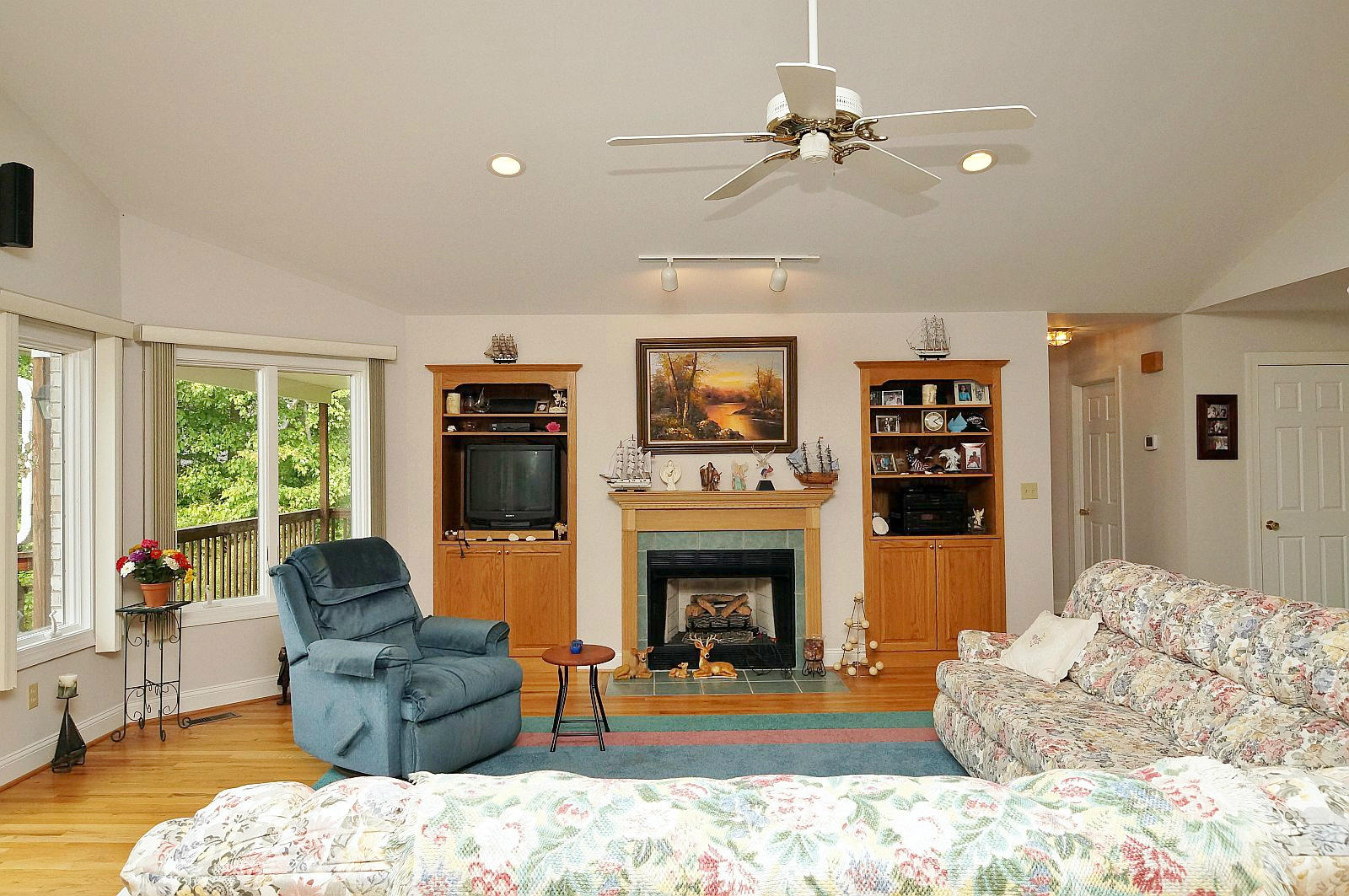 925 Somerset Cove Road Union Hall, VA 24176 - Photo 8 of 35 a living room with furniture a fireplace and a flat screen tv