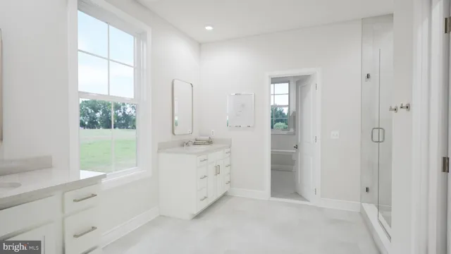a kitchen with a center island appliances and cabinets