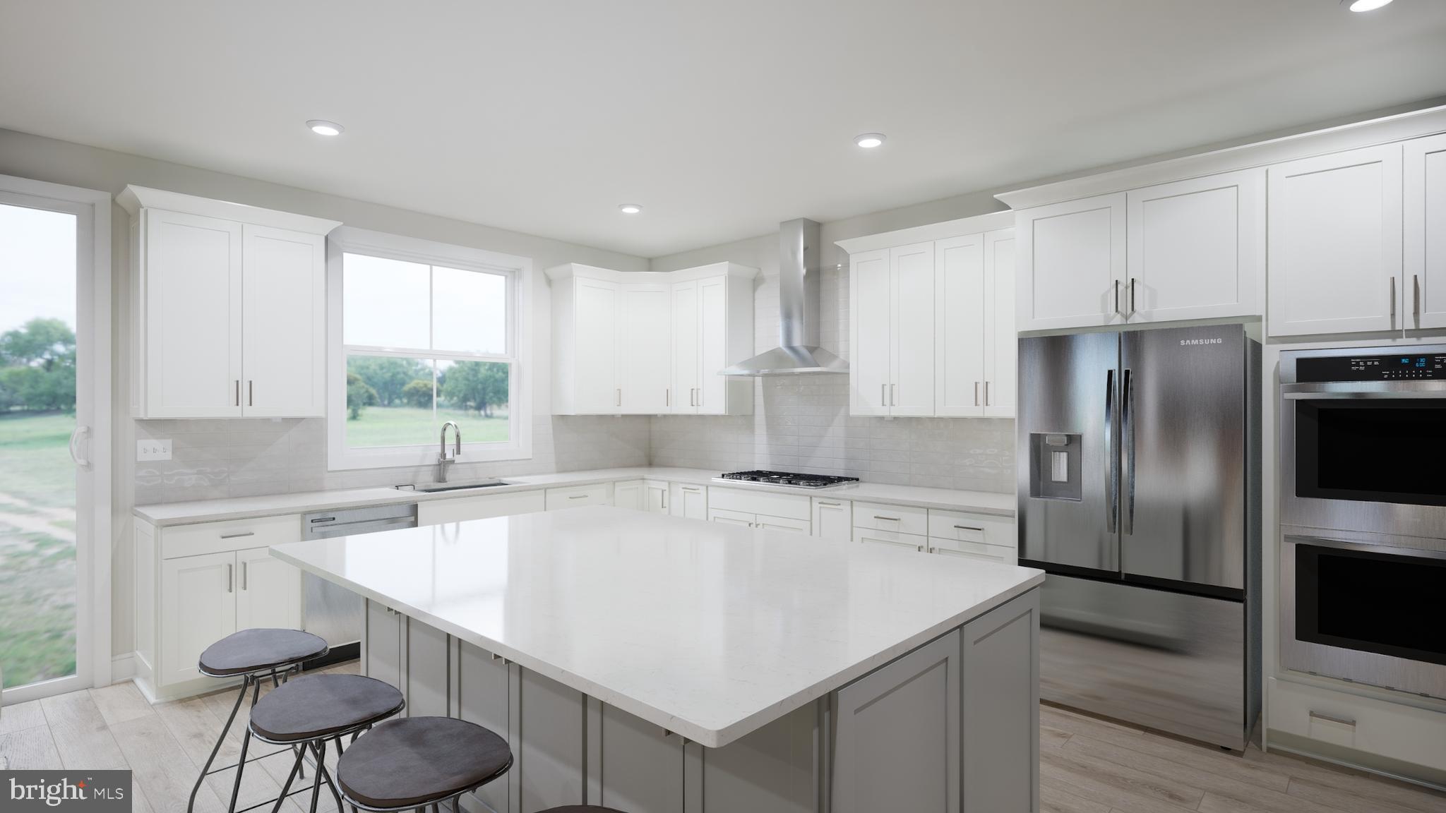 Snowden Bridge Boulevard, Unit SHELDON Stephenson, VA 22656 - Photo 9 of 53 a kitchen with a sink a center island and stainless steel appliances