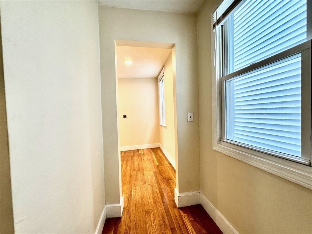 6 Calder Street, Unit 3 Boston, MA 02124 - Photo 11 of 23 a view of hallway with wooden floor