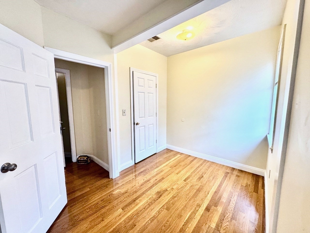 6 Calder Street, Unit 3 Boston, MA 02124 - Photo 13 of 23 a view of a room with wooden floor and closet
