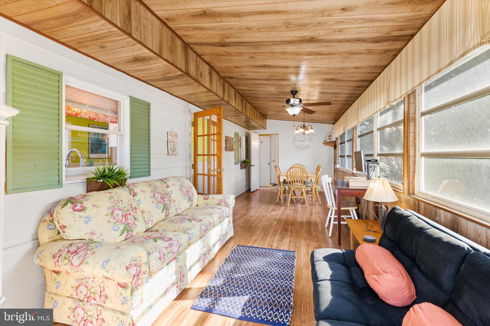 36466 Old Mill Road Ocean View, DE 19970 - Photo 24 of 36 Large bright sunroom with seating area
