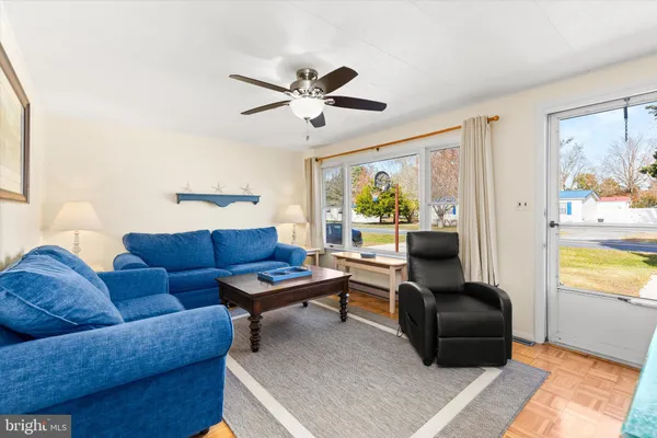 a living room with furniture and a window