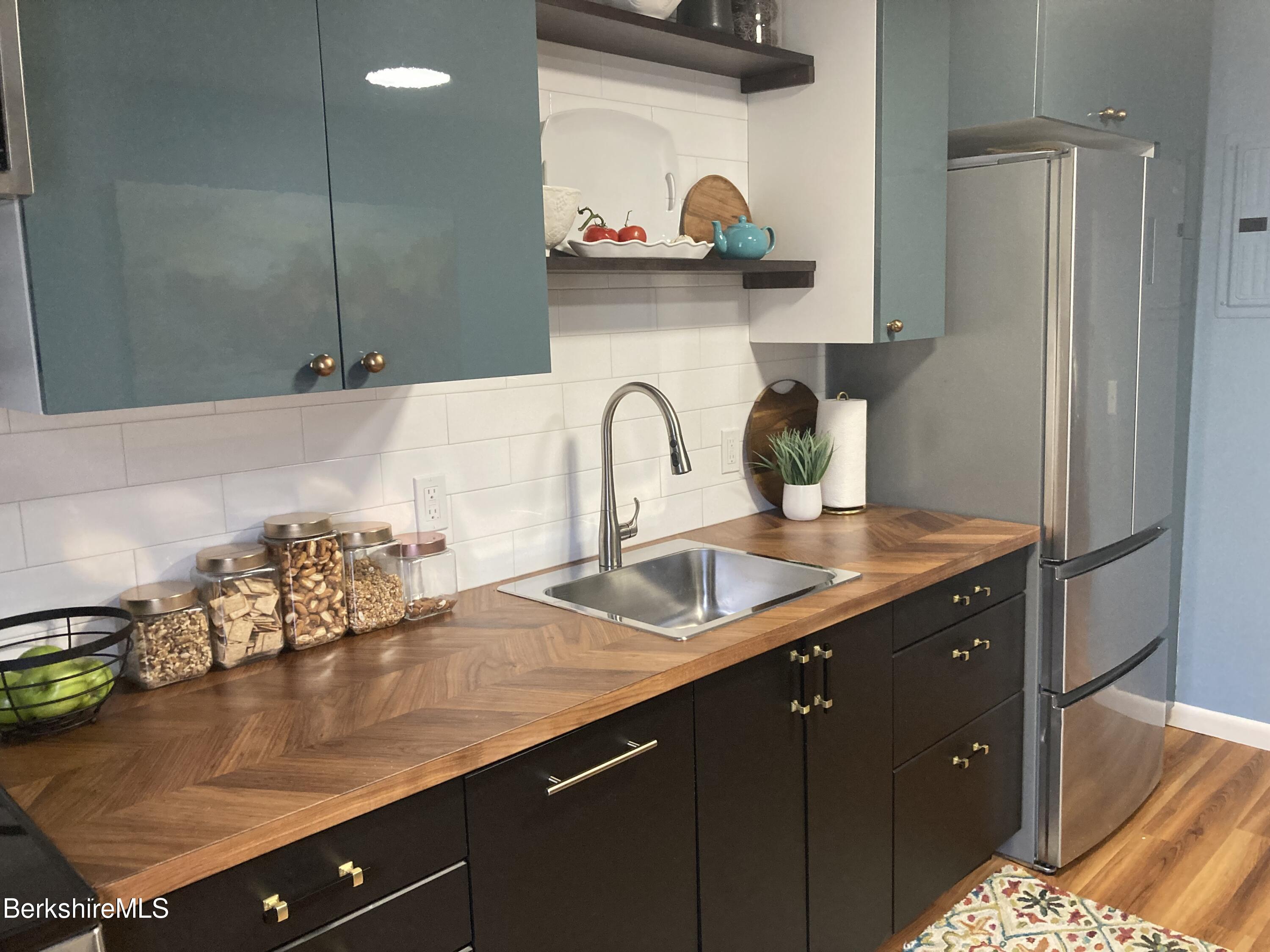 2 Morgan Manor, Unit 6 Lenox, MA 01240 - Photo 12 of 32 a kitchen with a sink and a stove